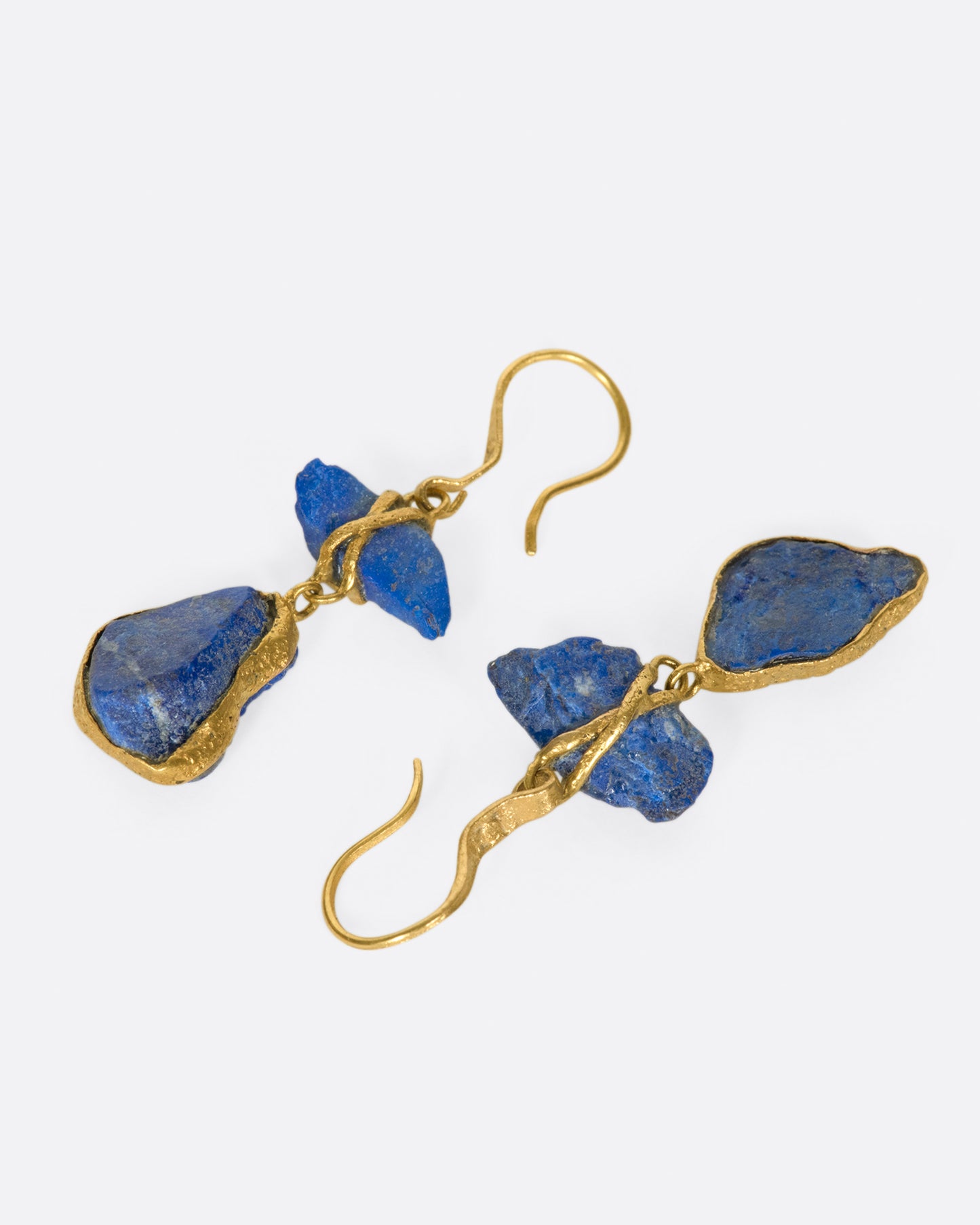 Vibrant, raw, Afghan lapis pebbles wrapped in high karat gold.