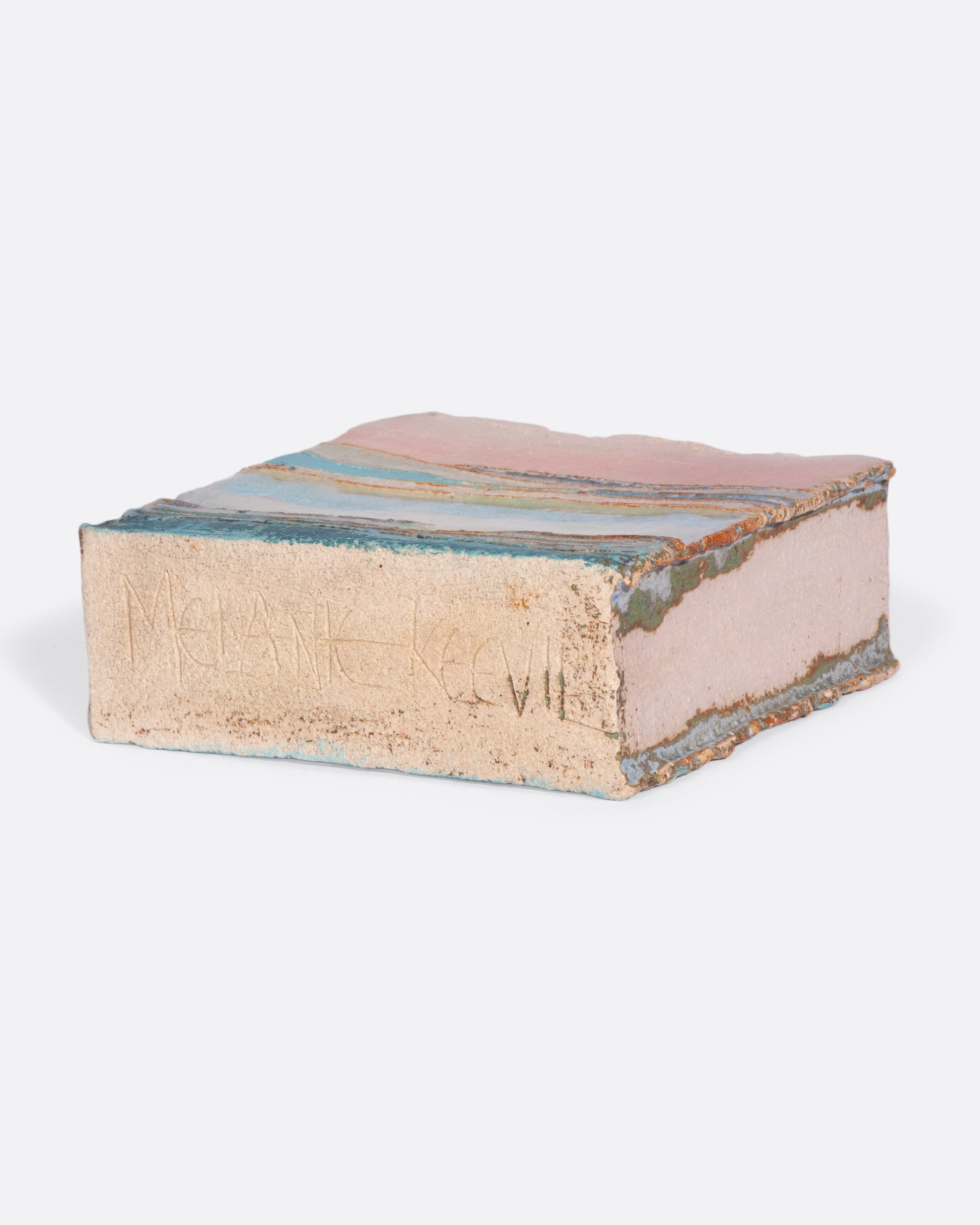 A ceramic vessel meticulously handmade with many layers of glaze atop stoneware clay. The rich, varied texture becomes a beautiful canvas for an ethereal landscape like you're gazing over a lake while the sunsets golden over hills in the distance.