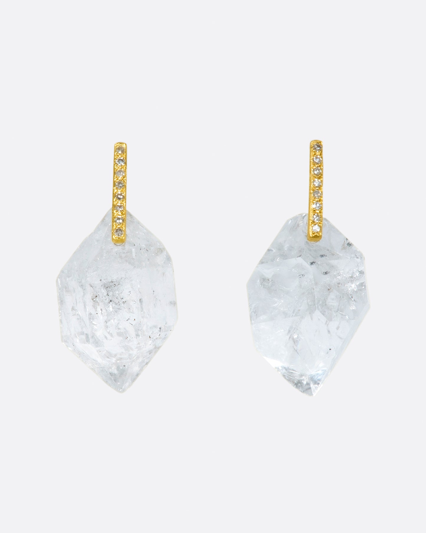 Save for their diamond-dotted posts, these earrings are about one thing and one thing only; their octahedron-like crystal drops.
