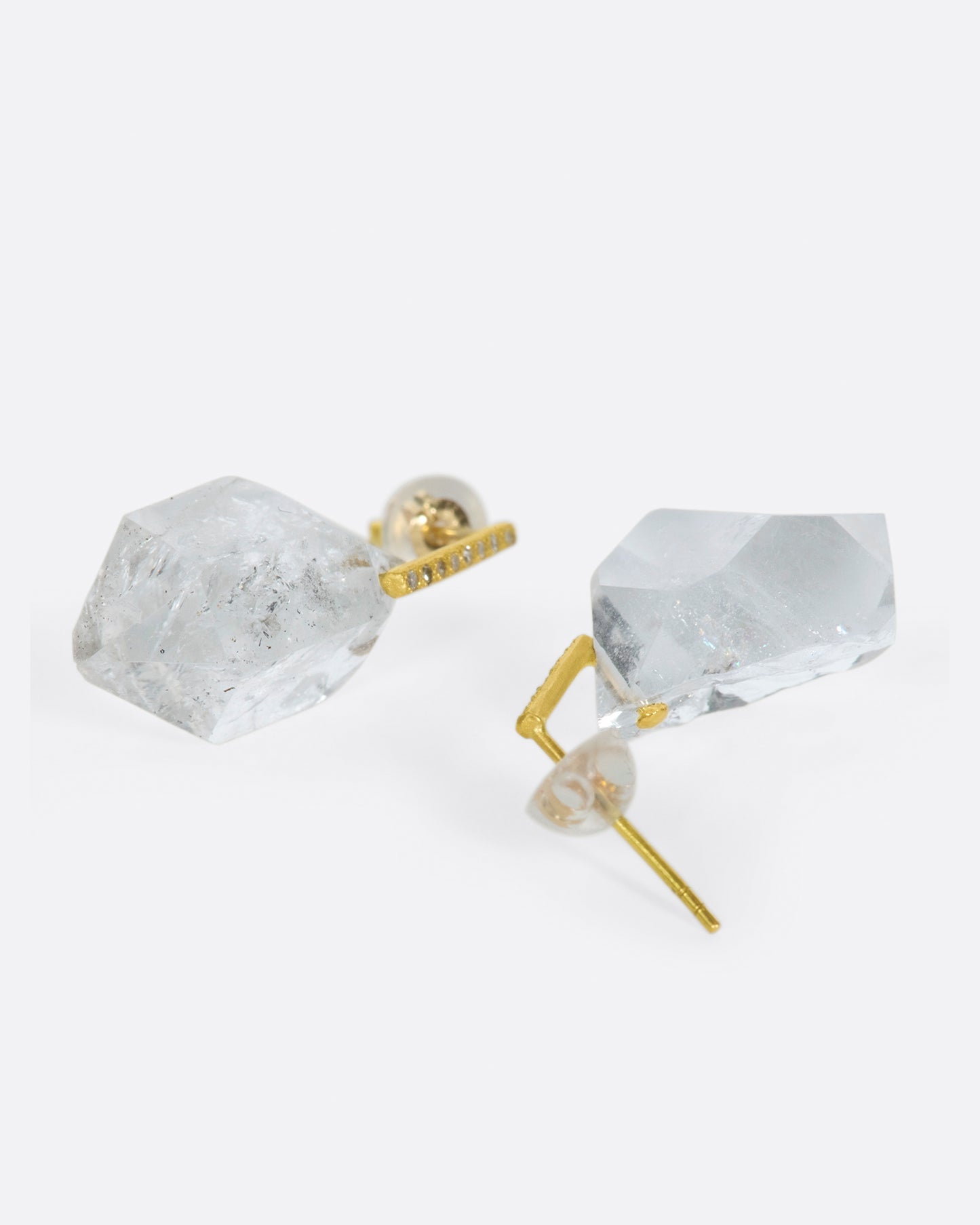 Save for their diamond-dotted posts, these earrings are about one thing and one thing only; their octahedron-like crystal drops.