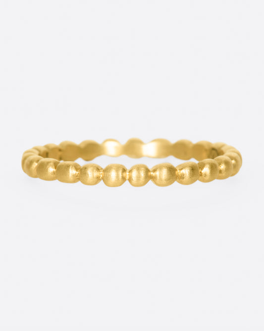 The quintessential gold stacker. A perfect way to add simple texture between your gem-heavy rings, while still looking great next to cigar bands. This comes in three different widths.