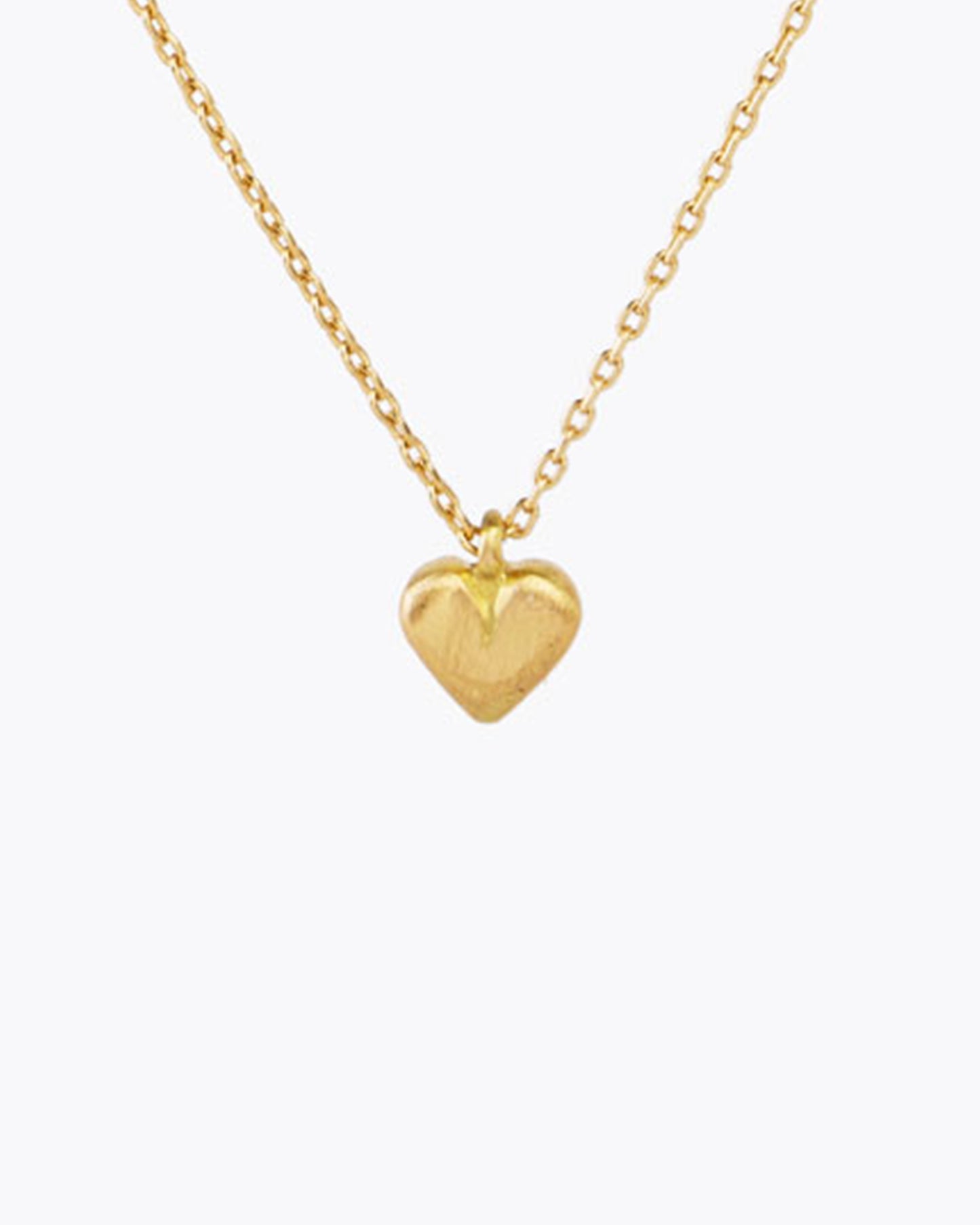 A simple but elegant heart necklace, with a brushed gold finish