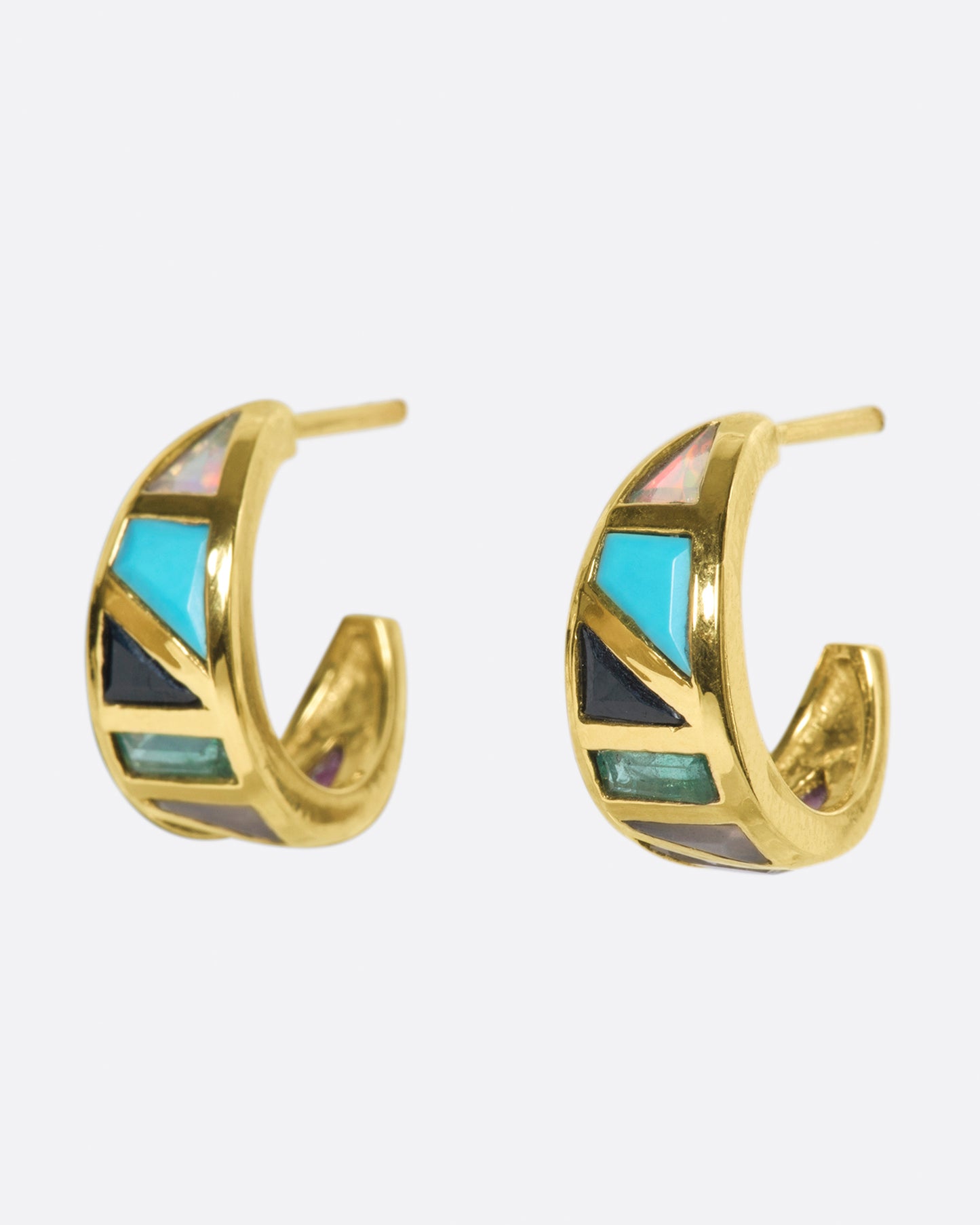 A special pair of mosaic huggies with a cool color palette of hand-cut stones intricately set in 9k gold