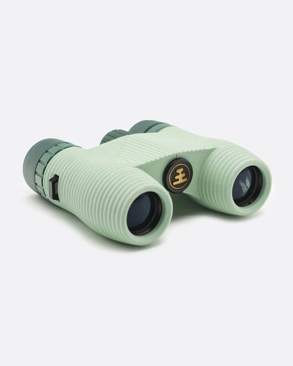 Nocs Standard Issue waterproof binoculars in glacial blue, compact pale green-blue binoculars with dark lenses
