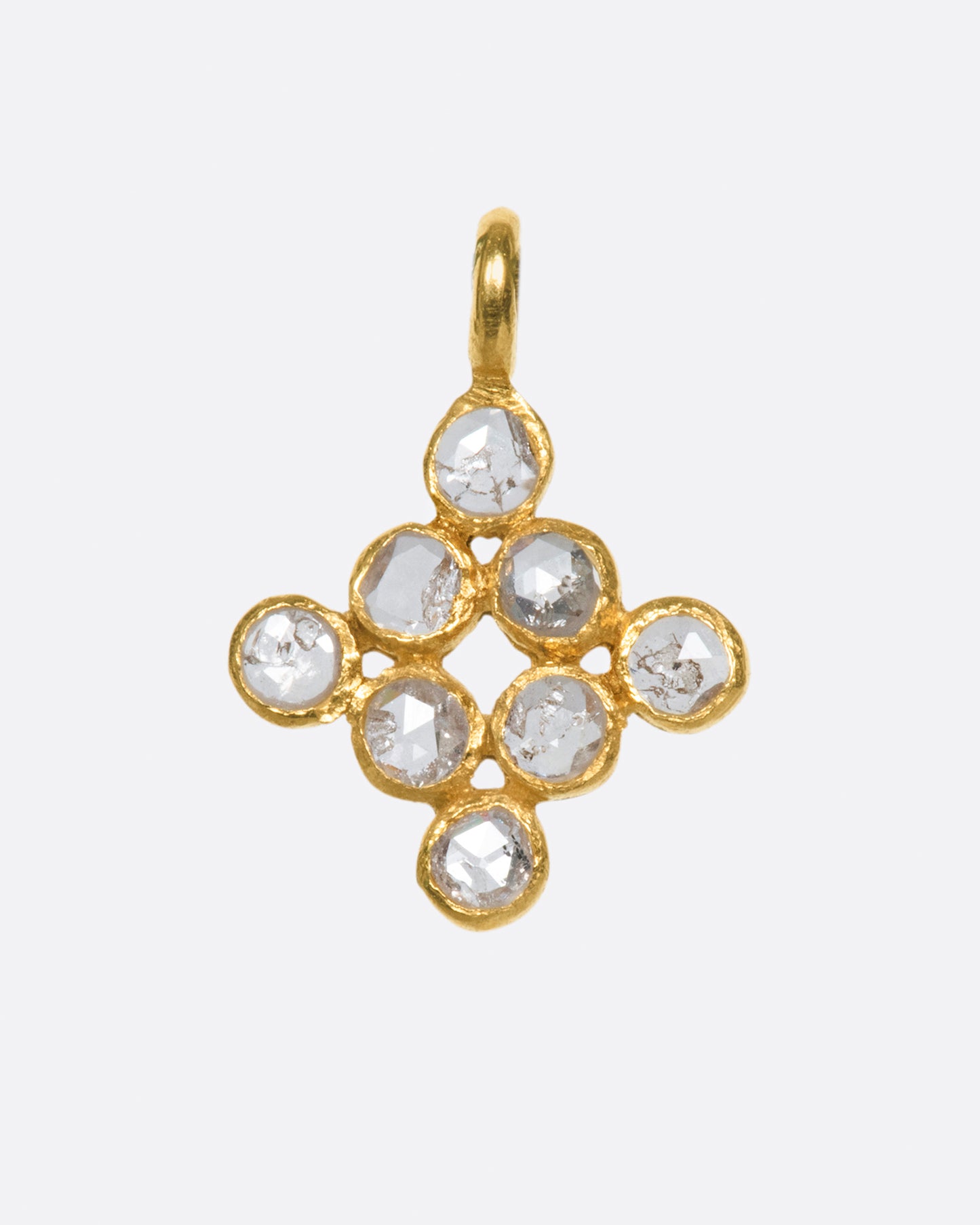 A symmetrical cluster of bezel set, rose cut diamonds; perfect to add some texture and shine to your ear without getting too glitzy (if there is such a thing).