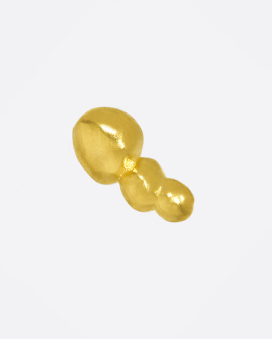 Three granules of bright, high karat gold to add some texture to your ear.