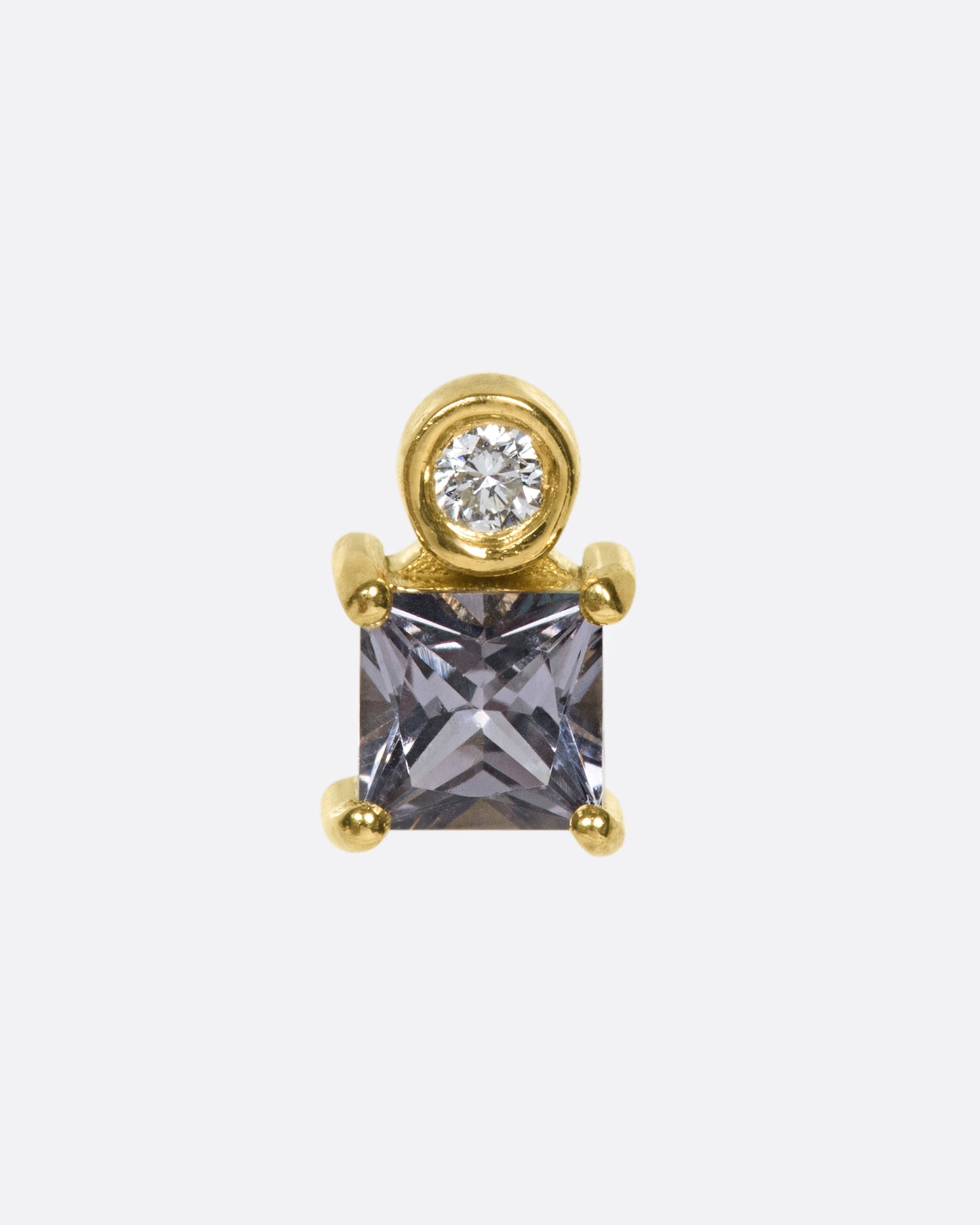 While the fancy, purple-gray spinel is the star of this piece, the diamond accent adds just the right about of brightness.