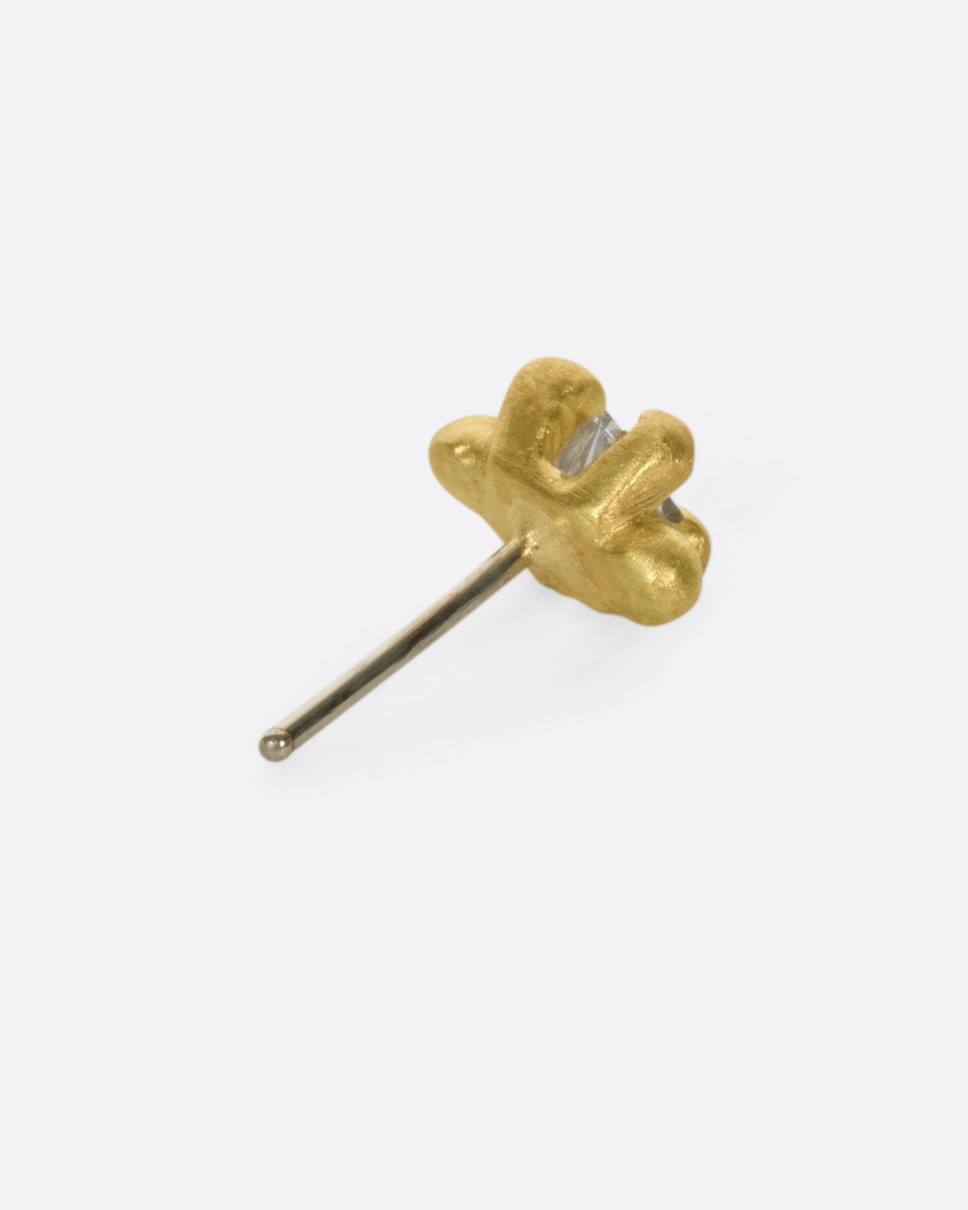 This solitaire stud's matte gold prongs make it more substantial, while remaining soft looking.