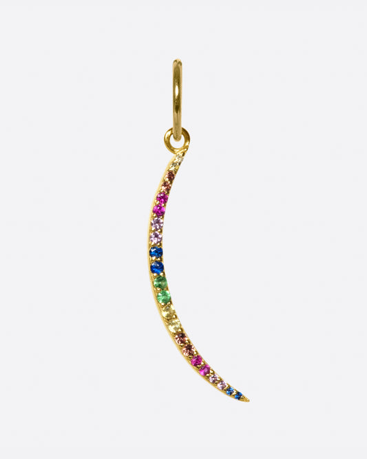 A curved, elongated gold sliver lined with rainbow sapphires. The length of this dangle makes it great for layering.