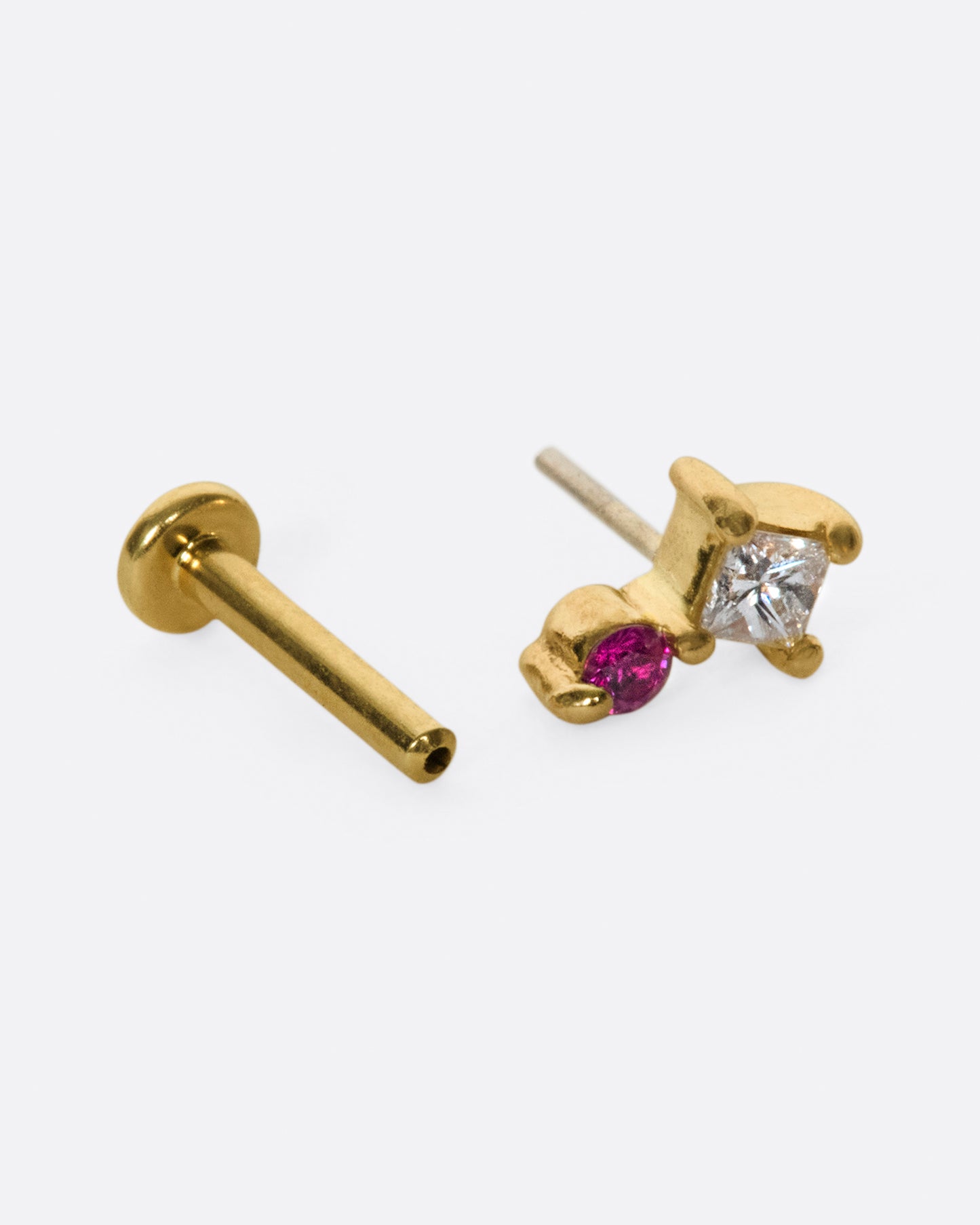 A princess cut diamond stacked with a round pink sapphire; this earring front looks great no matter which direction it's facing.