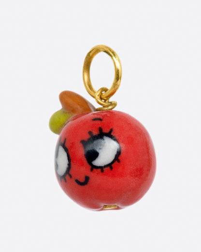 Porcelain red apple face charm, angled view of the face