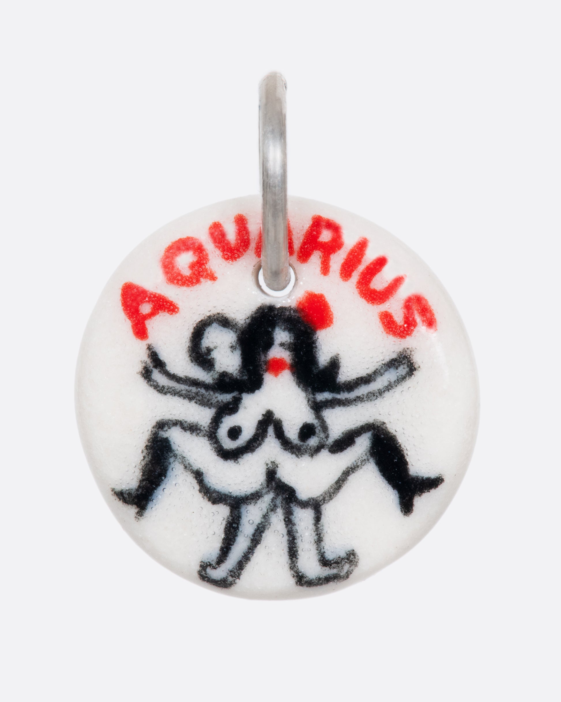 A handmade and painted porcelain zodiac disc charm with a sterling silver bail, featuring a sex position specific to each zodiac.