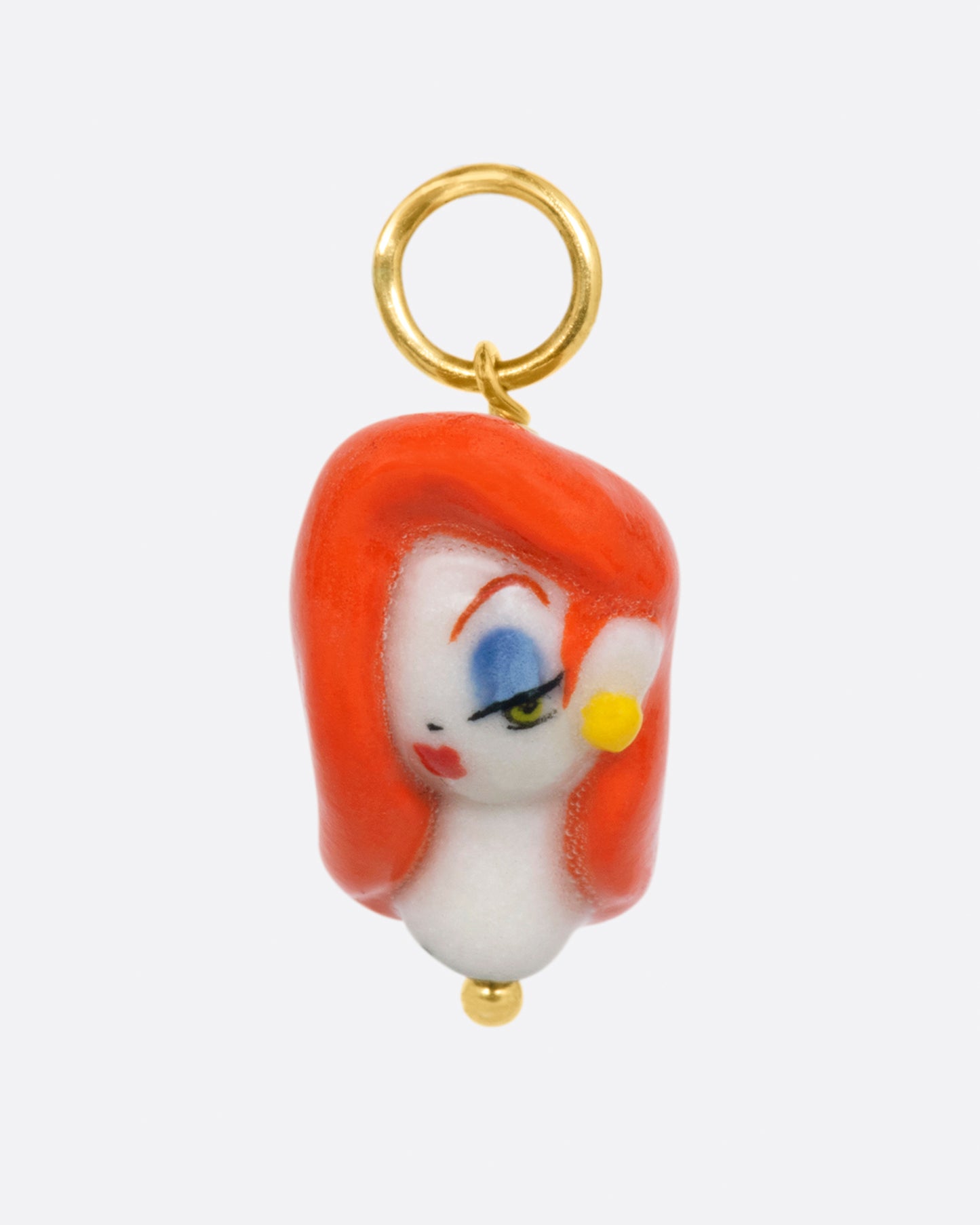 A handmade porcelain charm in the 3D shape of Jessica Rabbit with a yellow gold bail.