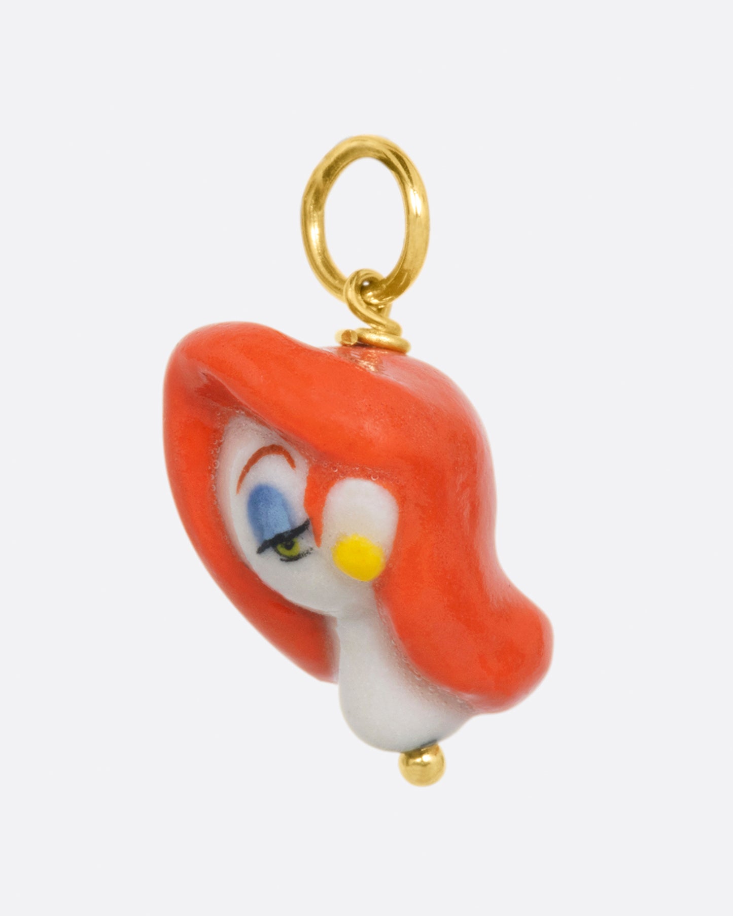 A handmade porcelain charm in the 3D shape of Jessica Rabbit with a yellow gold bail.