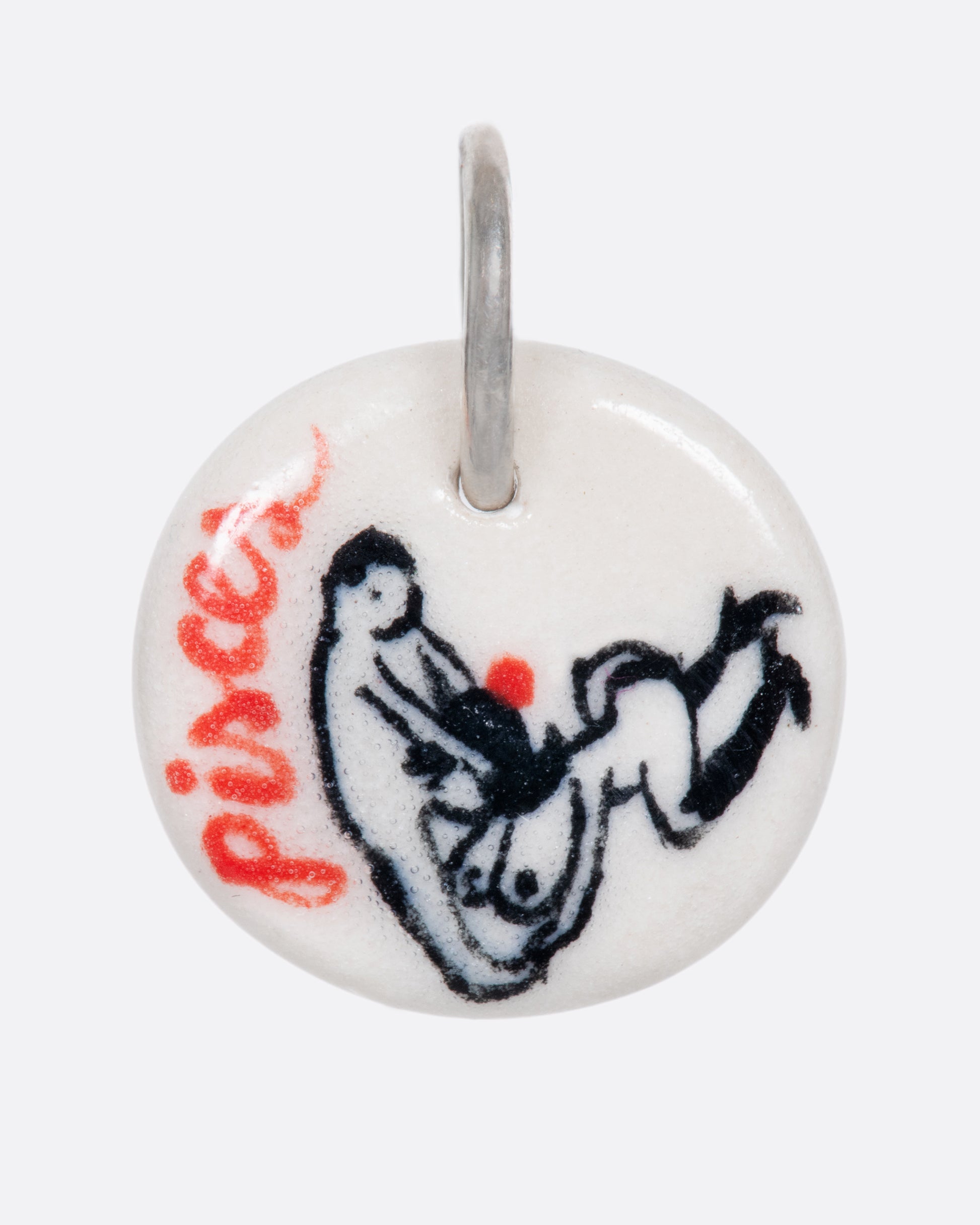 A handmade and painted porcelain zodiac disc charm with a sterling silver bail, featuring a sex position specific to each zodiac.