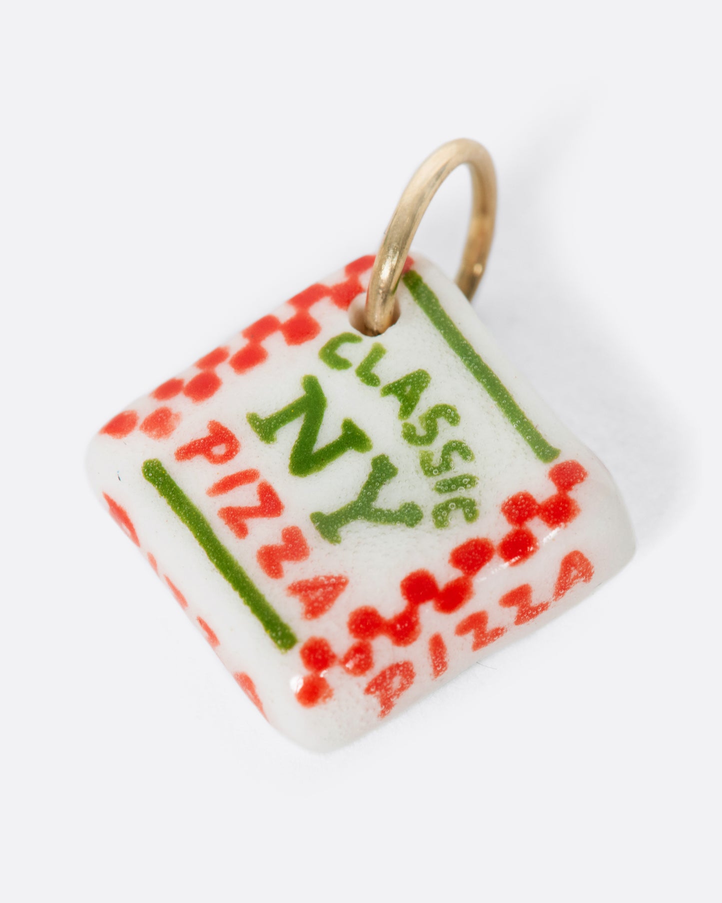 A white porcelain Classic New York pizza box charm with a yellow gold bail