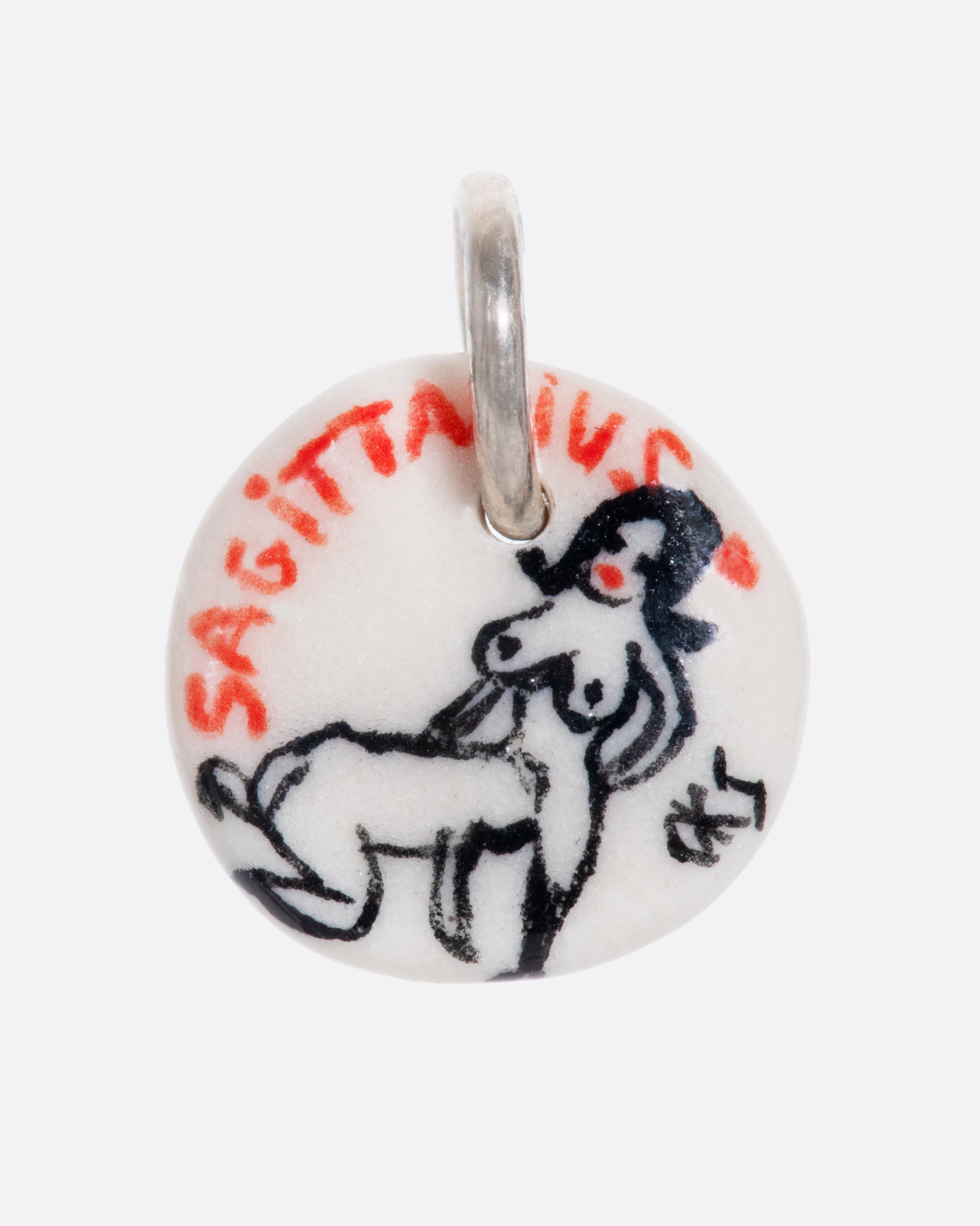 A handmade and painted porcelain zodiac disc charm with a sterling silver bail, featuring a sex position specific to each zodiac.