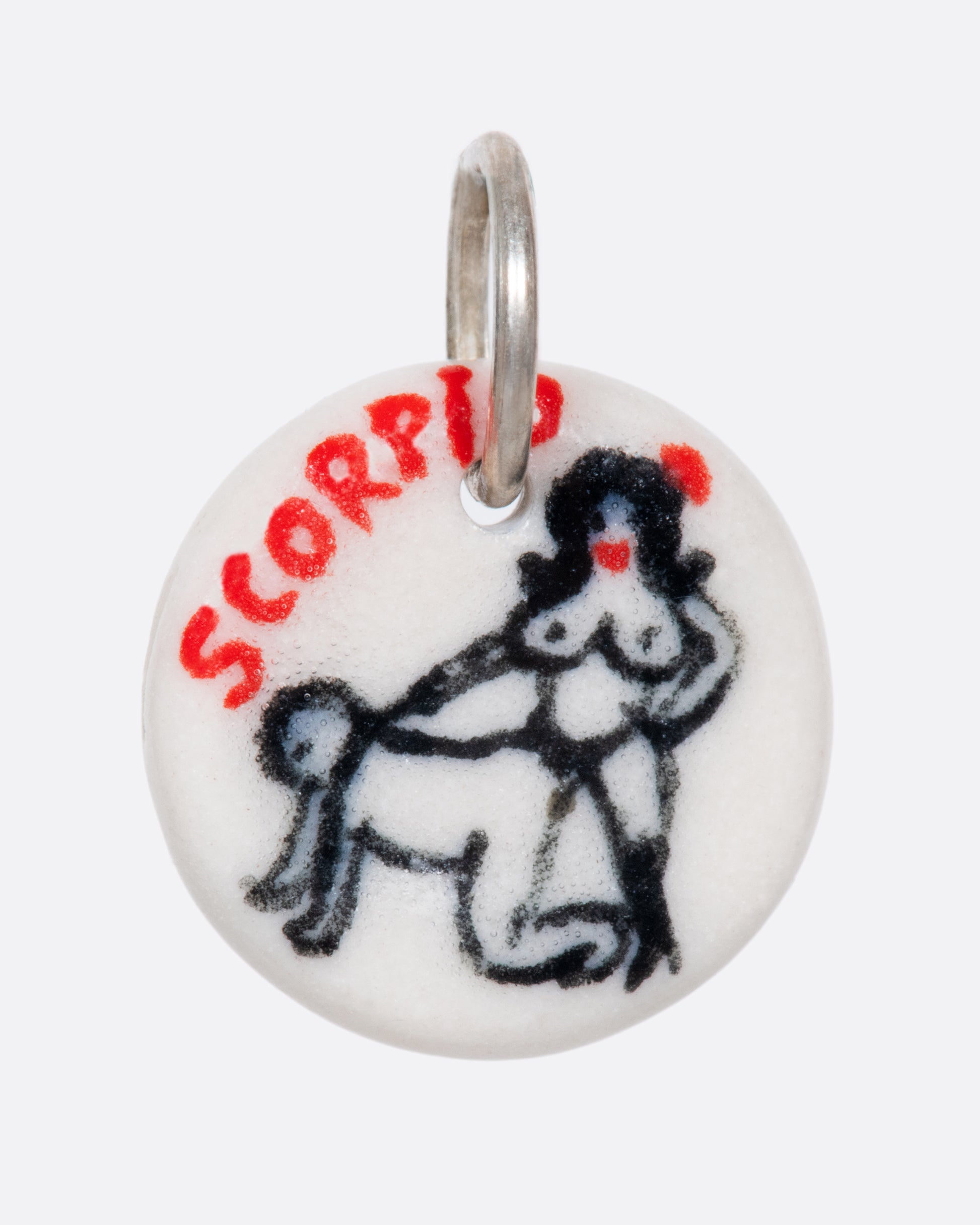 A handmade and painted porcelain zodiac disc charm with a sterling silver bail, featuring a sex position specific to each zodiac.