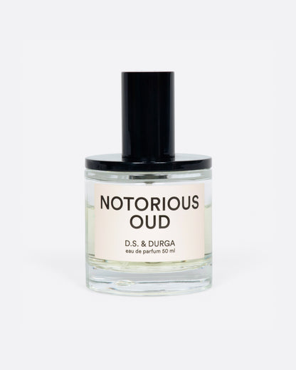 D.S. & Durga Notorious Oud perfume, a clear glass bottle with a black cap and cream label