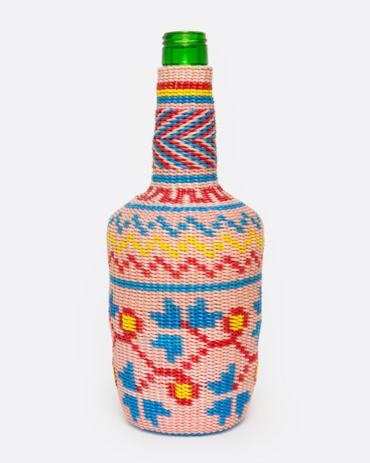 A glass Hungarian Miner's Bottle with a colorful pattern of woven electrical wire on top, shown from the front.