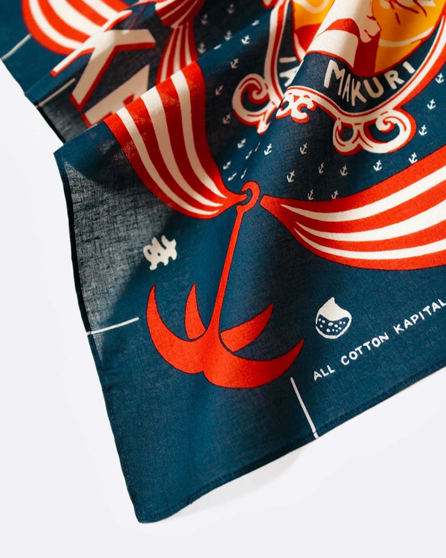 A close up of a navy, red, and white bandana.