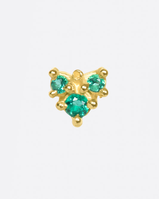 The stones on this arrow earring glow; a perfect pop of color.