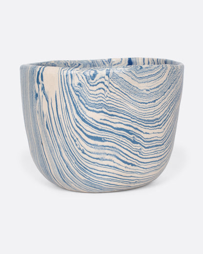 Sam Andrew nerikomi bowl in blue narrow stripes, a handmade bowl with swirling marbled blue and cream clay