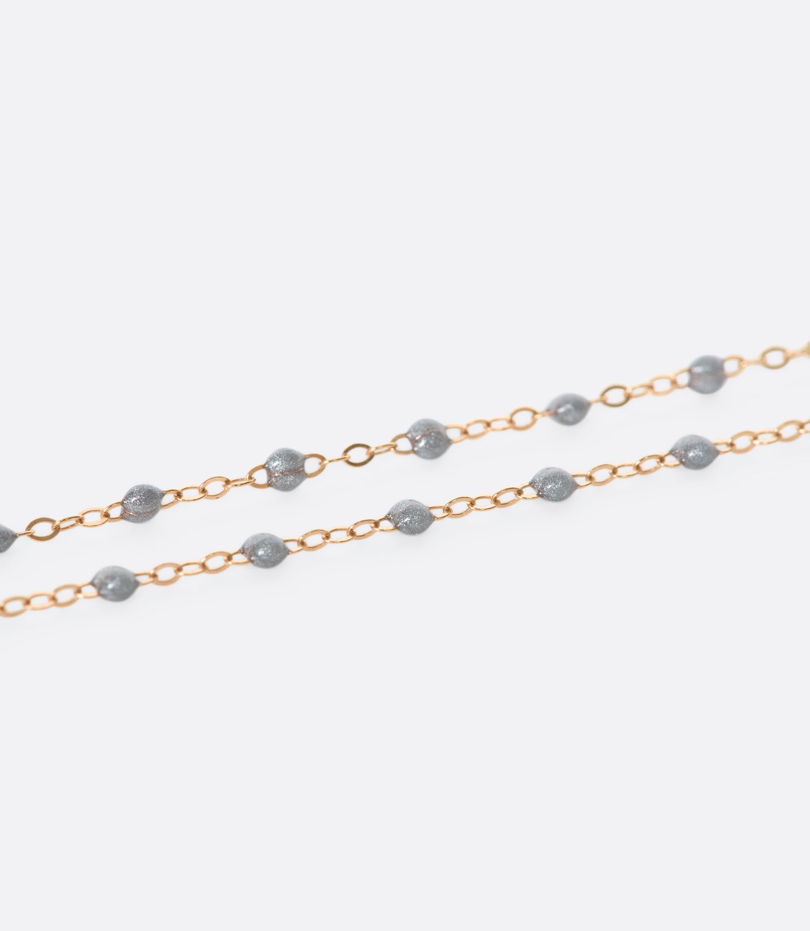 Thin 18k yellow gold chain necklace with resin beads. Each necklace is hand dipped in melted resin to create the beaded effect. 