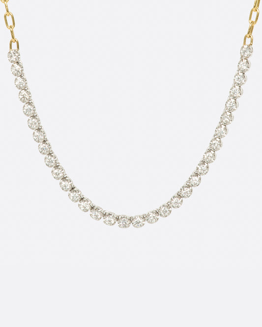 A yellow gold, oval link, chain necklace with four inches of contrasting white diamonds