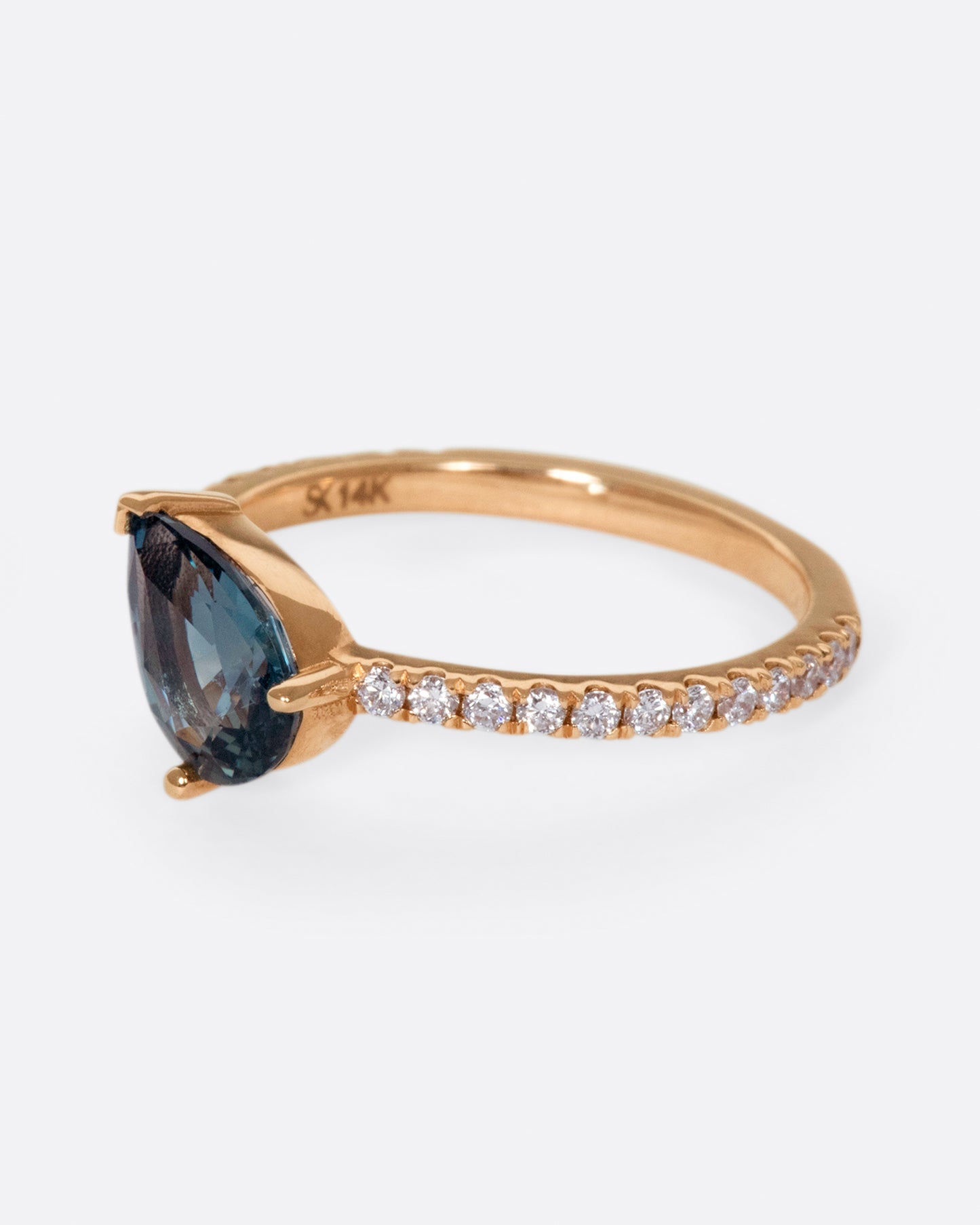 The saturated blue-green sapphire is the star of this ring.