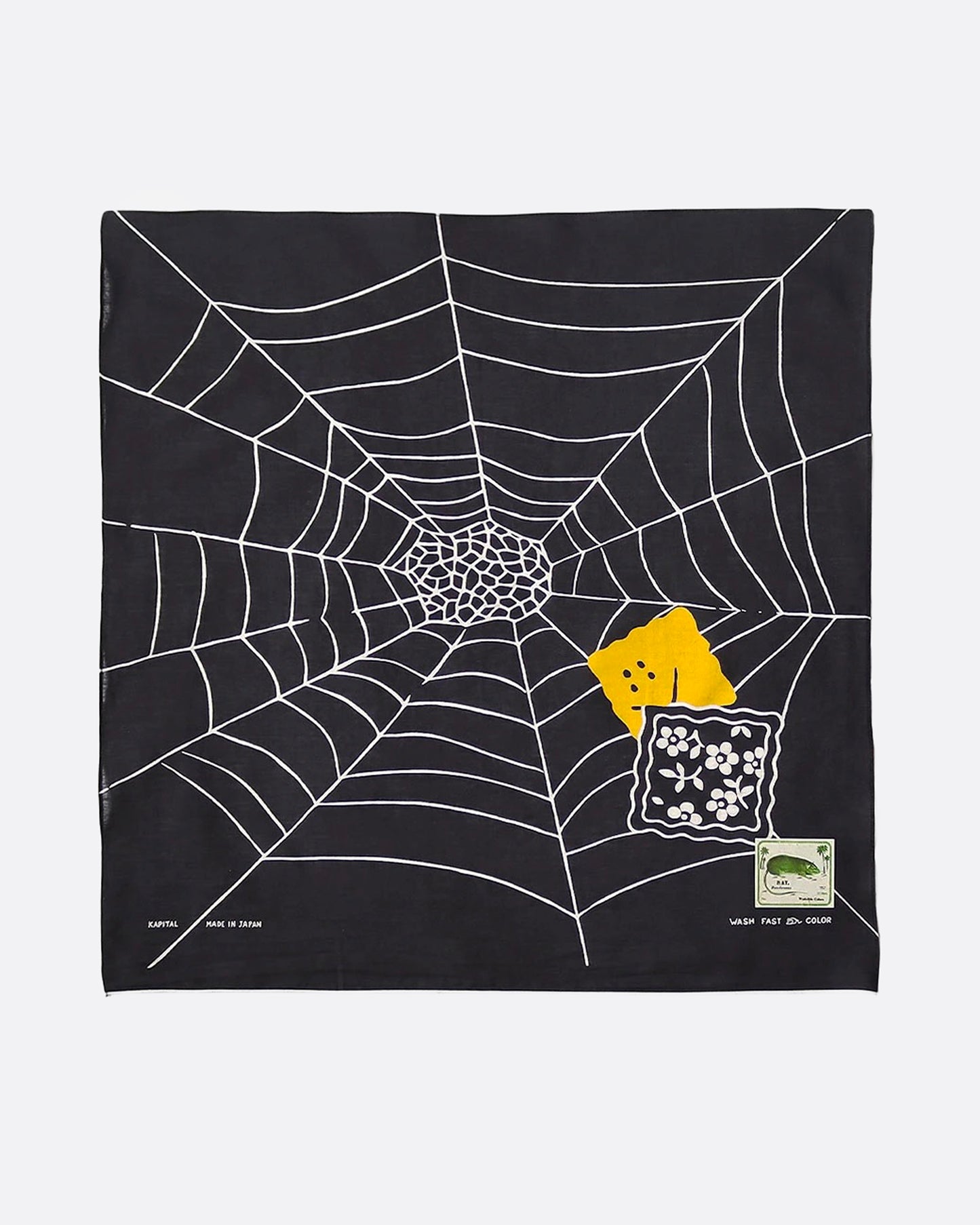 A black bandana with a white spider web and two colorful patch graphics in one corner, shown from the front.