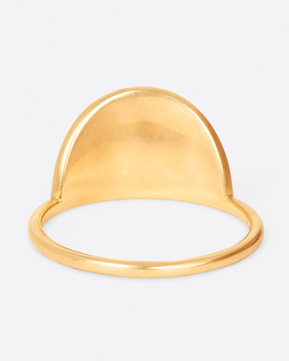 A yellow gold ring with a semi- circle spiral with three diamonds at its center. Shown from the back.