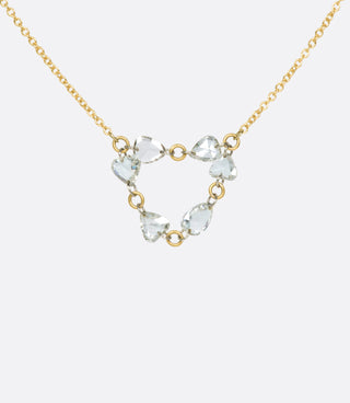 Shorter than most of Todd Pownell's necklaces, this piece lays right across the collarbone so that the pendant, made of six pear shaped diamonds, lays right in between.