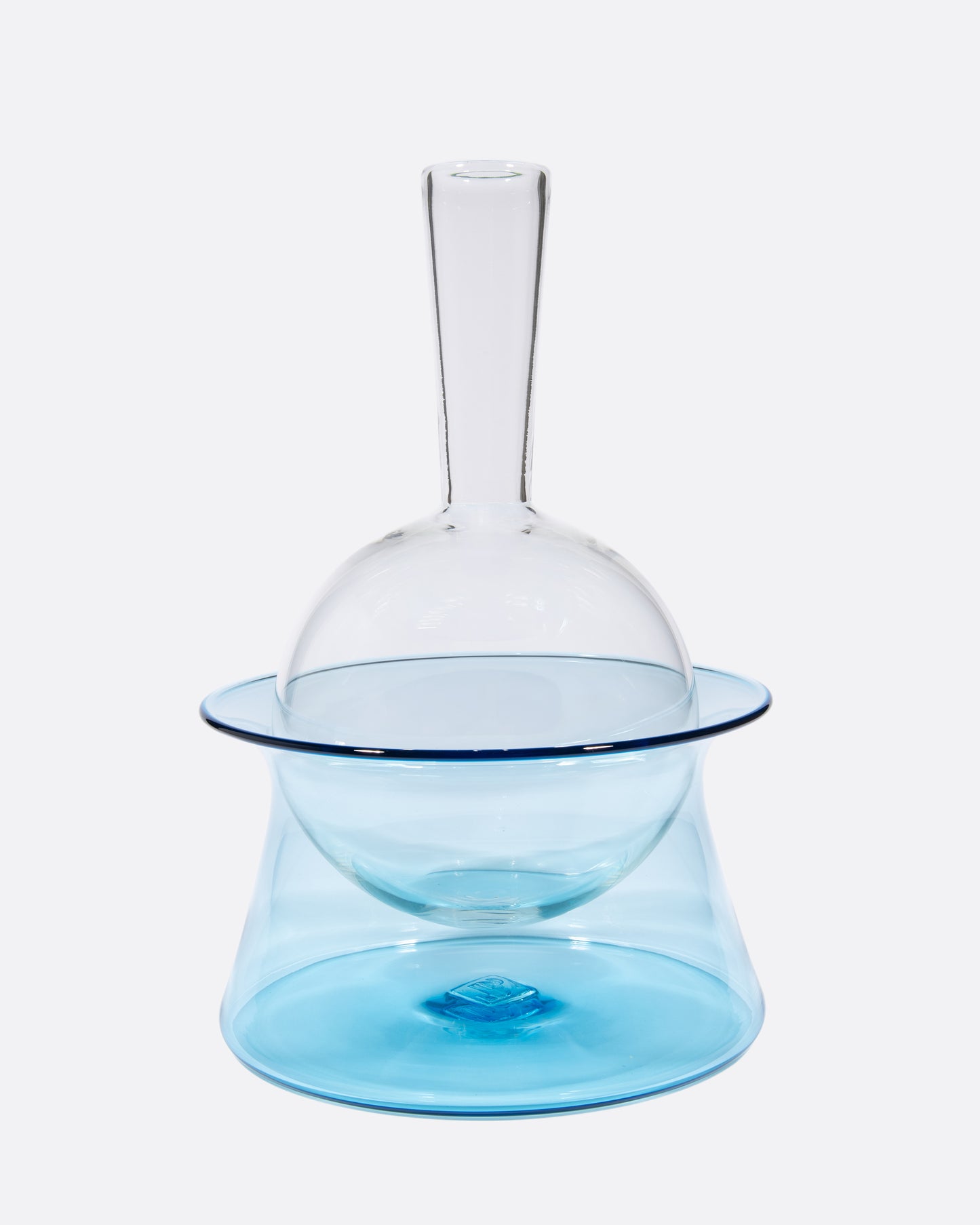 A blue glass decanter that sits in an ice bucket.