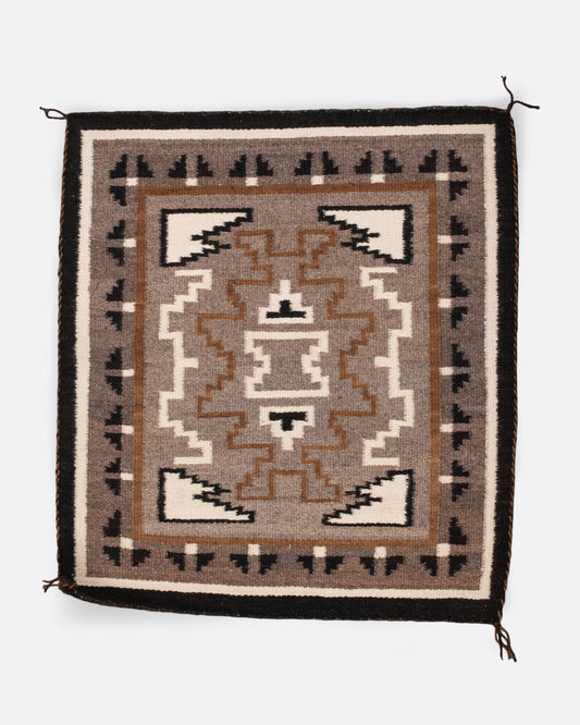 A vintage Navajo square rug with the traditional Two Grey Hills weaving