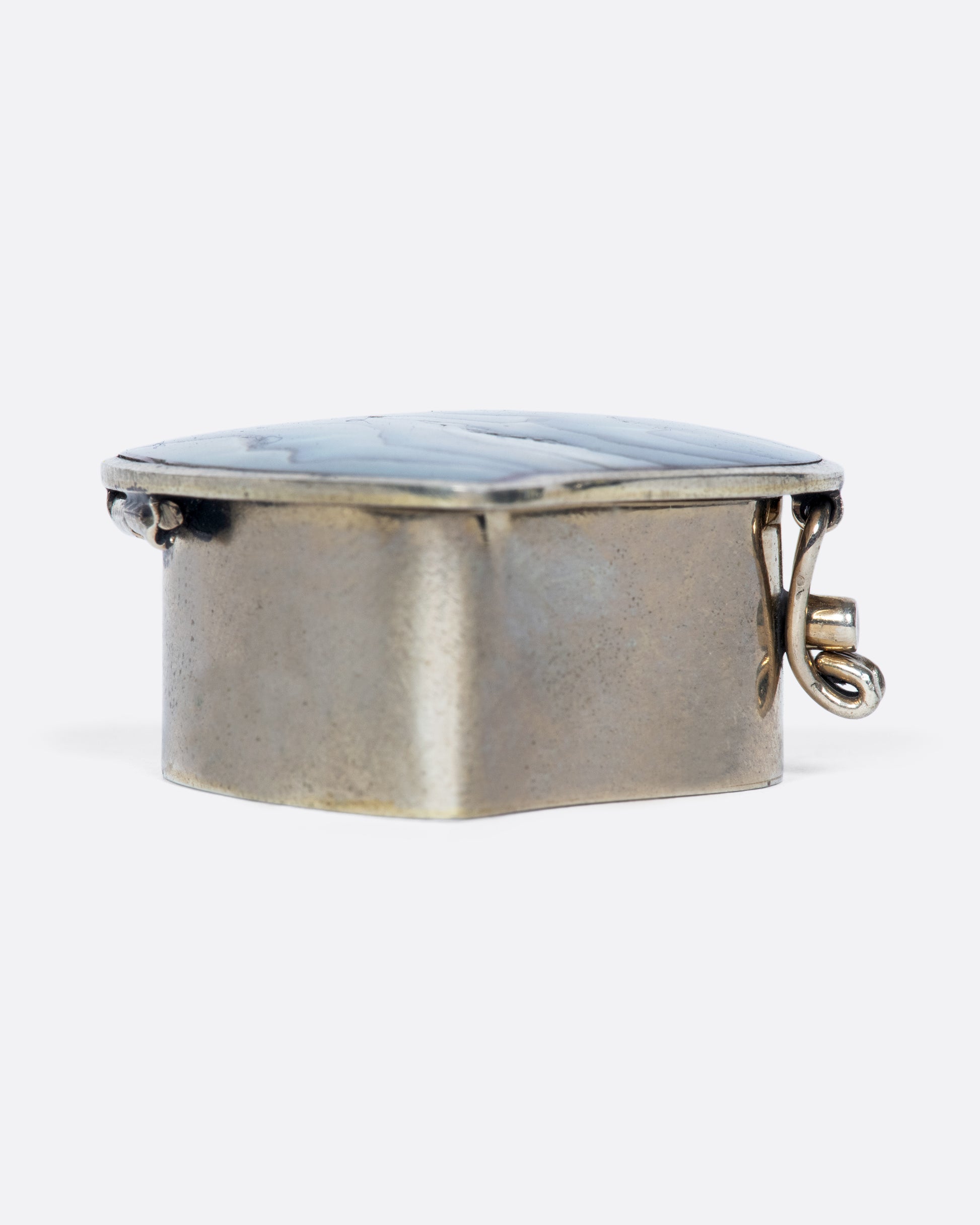 The heart-shaped abalone shell inlaid in this beautiful vintage box always makes us smile and think of the beach.