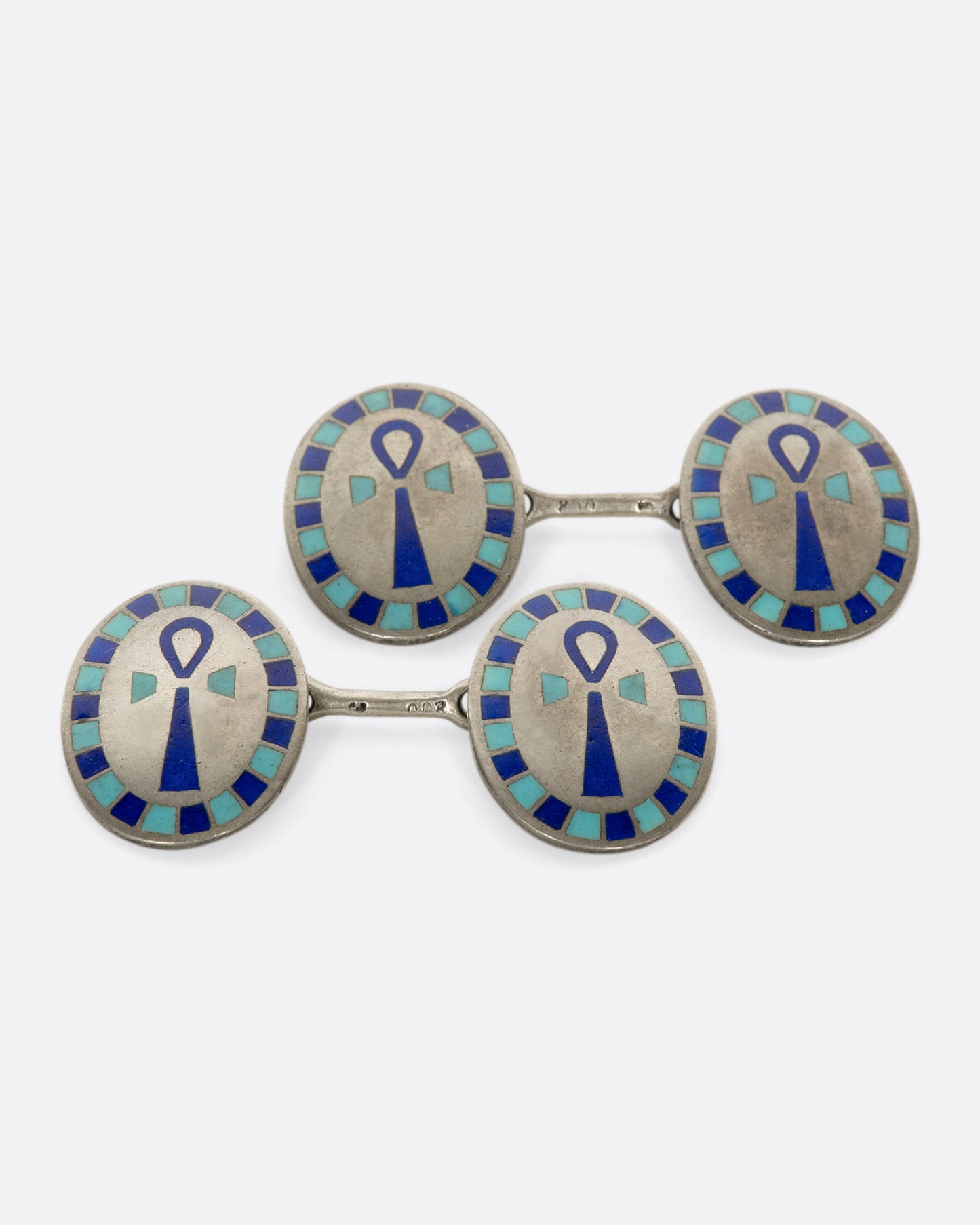 A pair of Egyptian Revival cufflinks featuring the Egyptian symbol of life, the ankh.