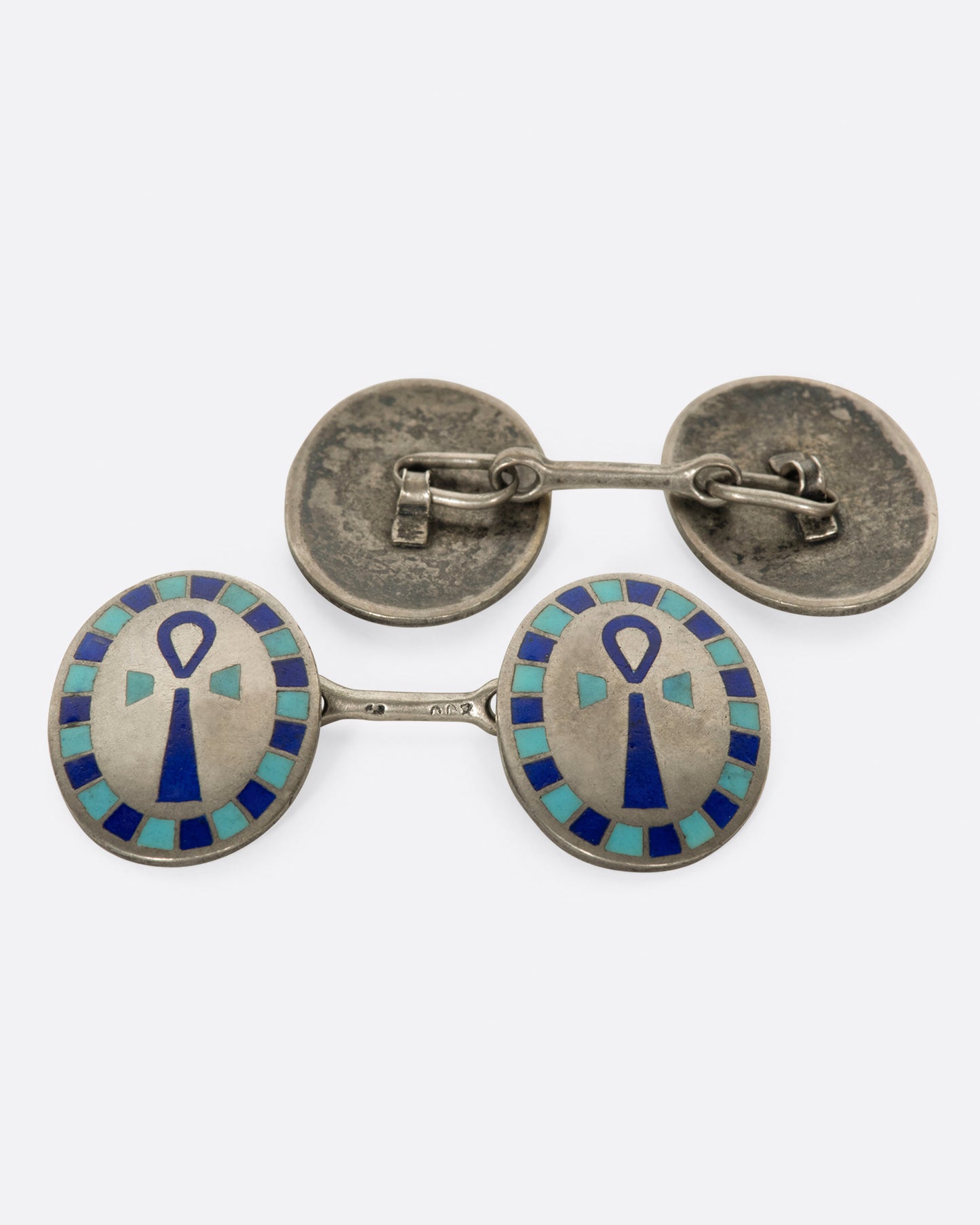 A pair of Egyptian Revival cufflinks featuring the Egyptian symbol of life, the ankh.