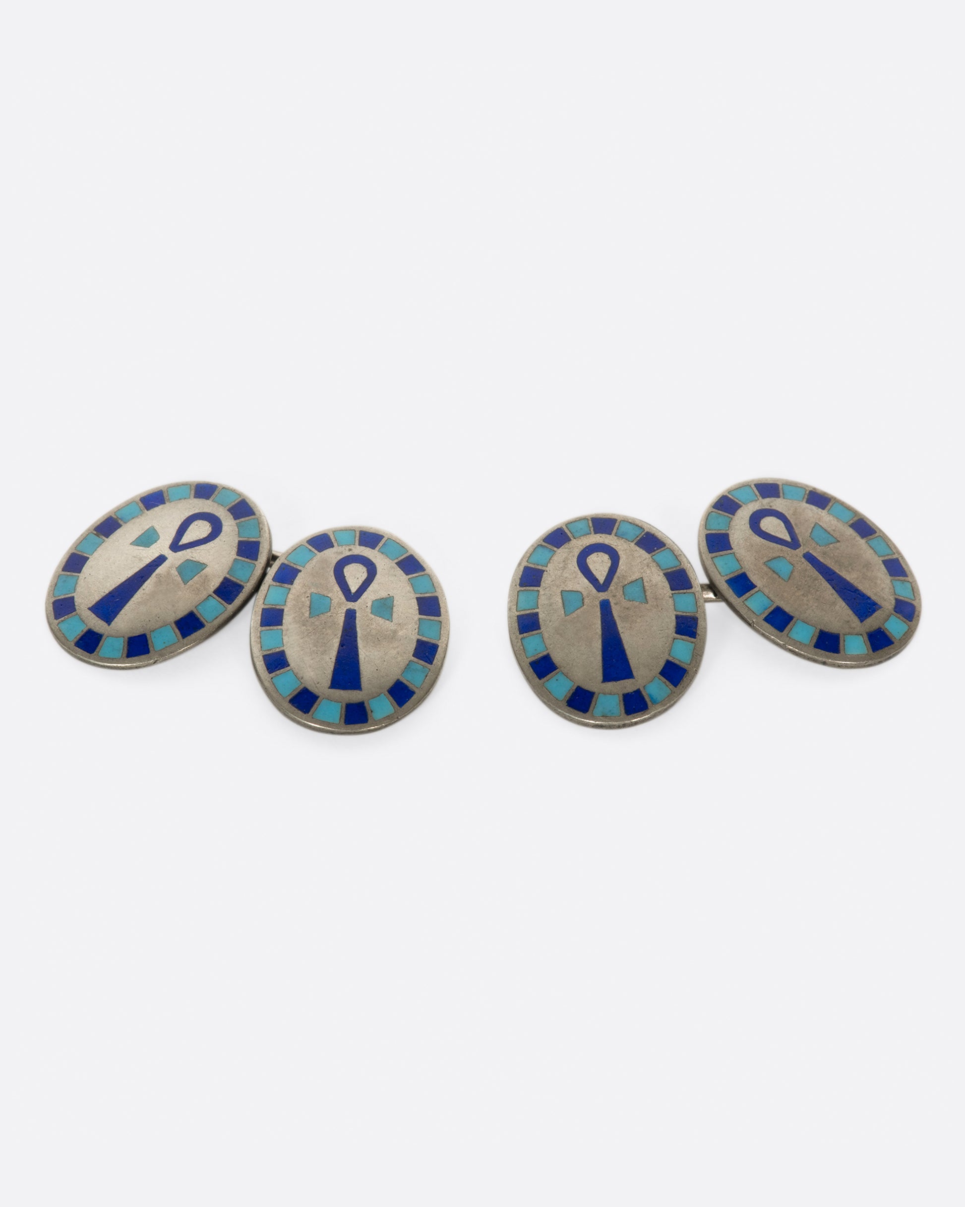 A pair of Egyptian Revival cufflinks featuring the Egyptian symbol of life, the ankh.