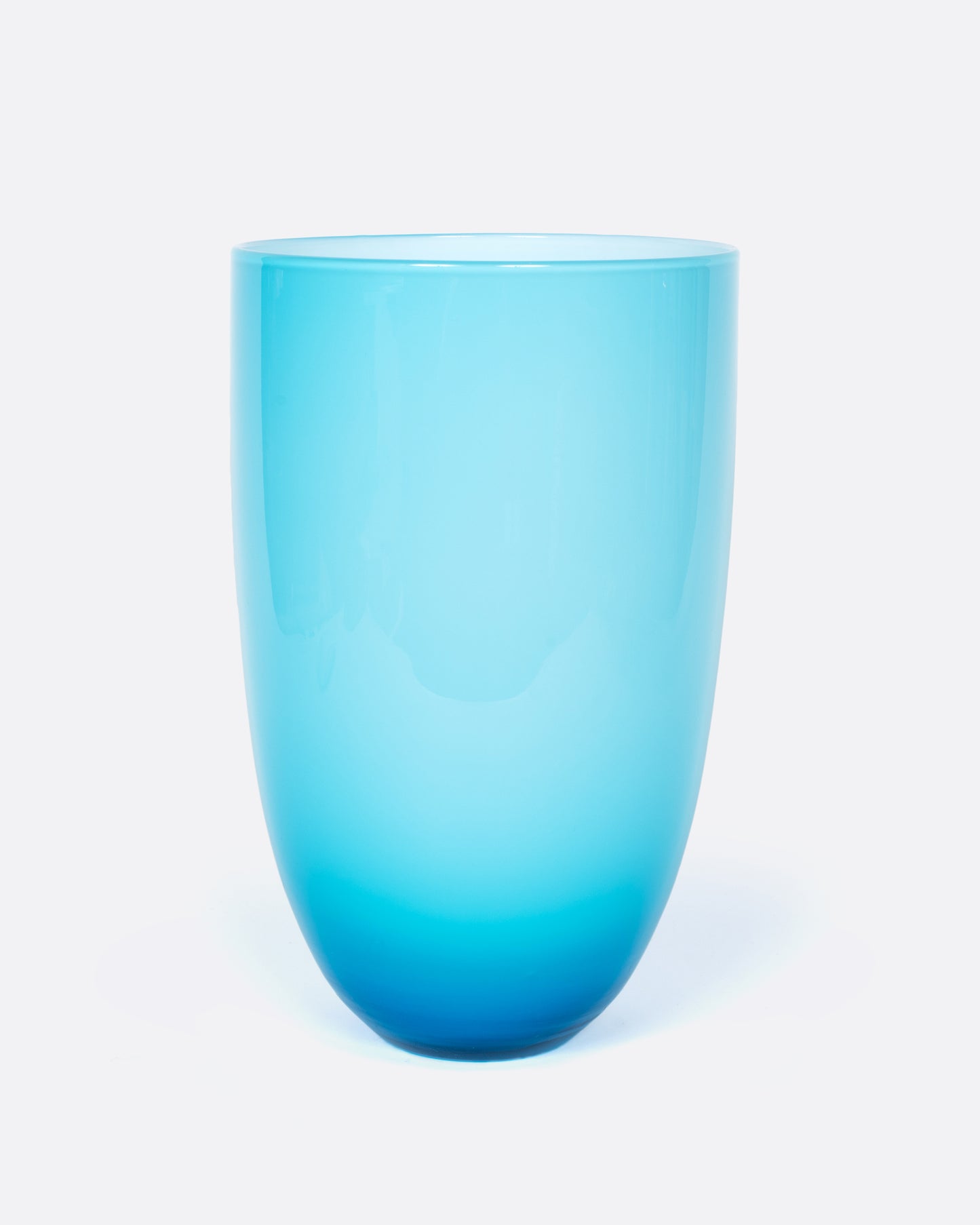 This sky blue vase has a layer of white glass on its interior to making the blue even brighter.