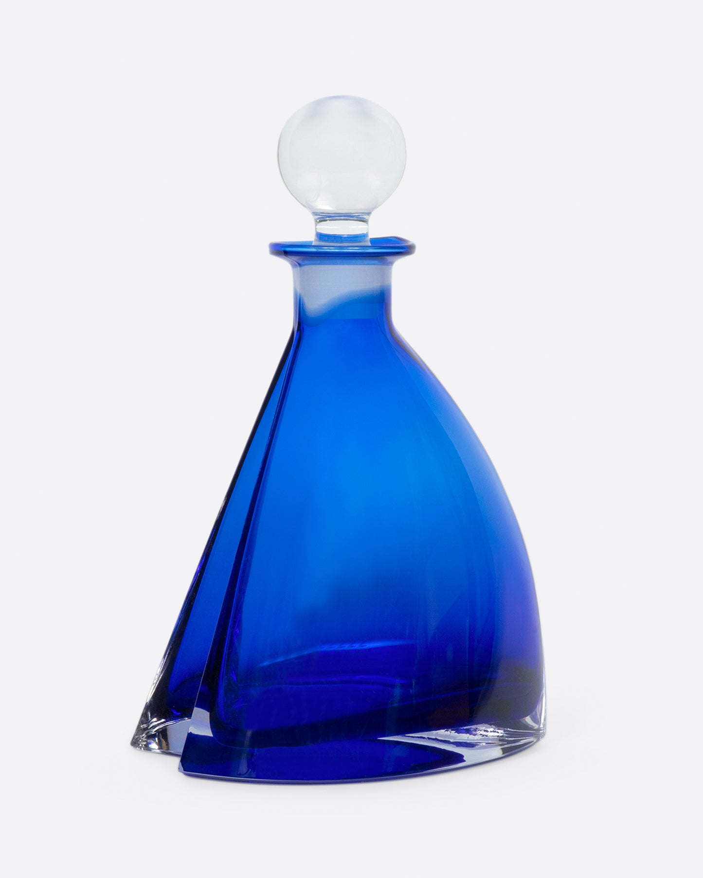 This heavy, heart-shaped bottle looks different from every angle.