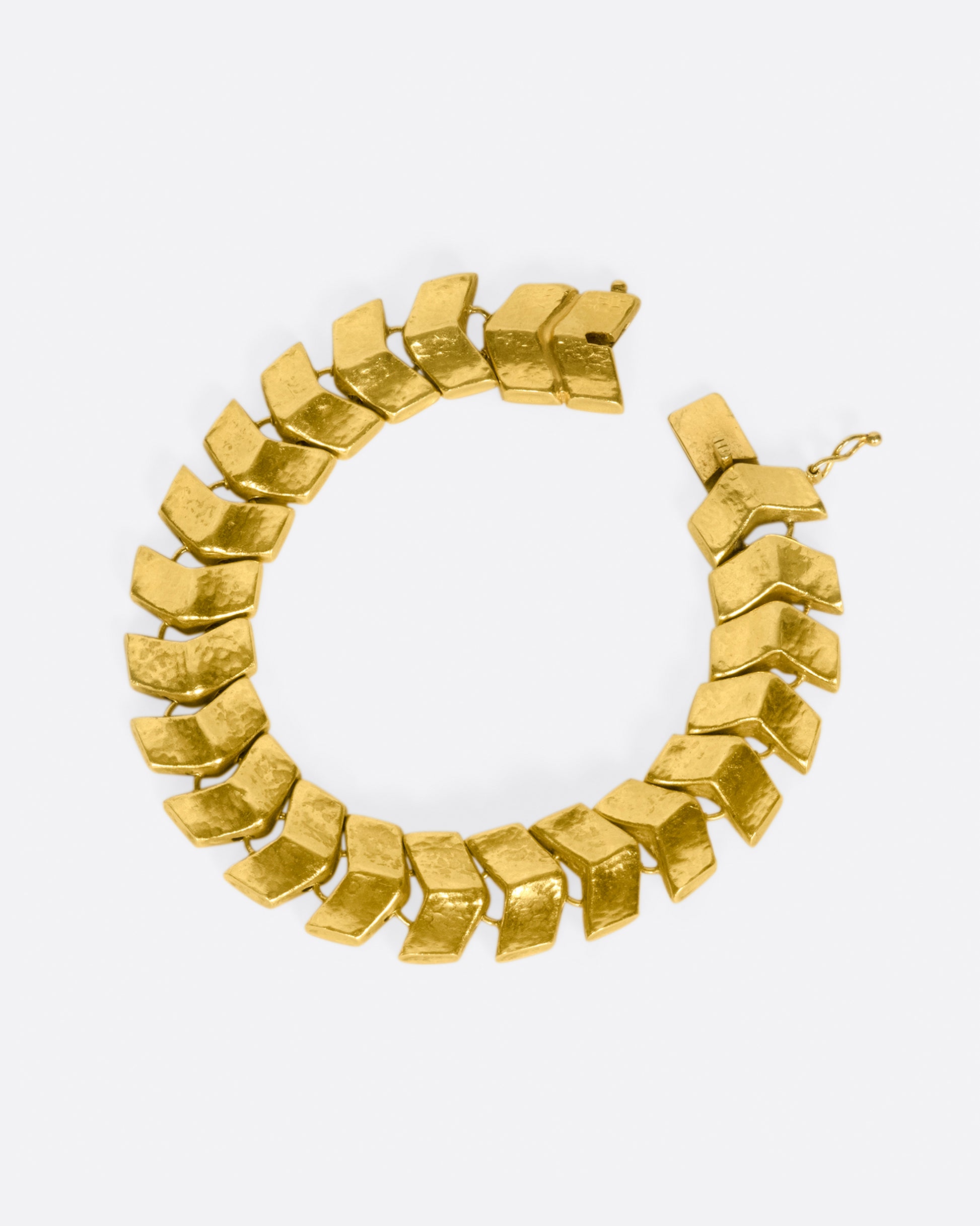 Made from buttery, high karat gold, the links on this bracelet are both substantial in size and in impact.