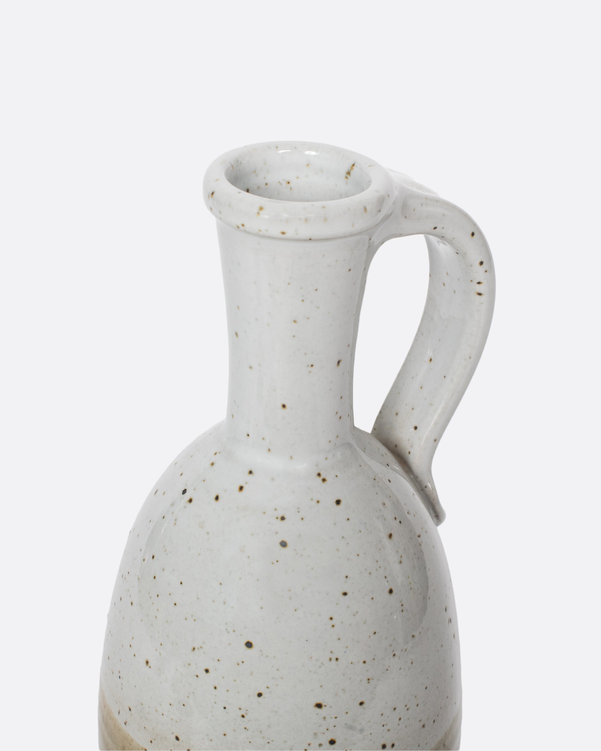 This vintage ceramic wine decanter is glazed with muted earth tones that make sharing a bottle of red an even cozier experience.