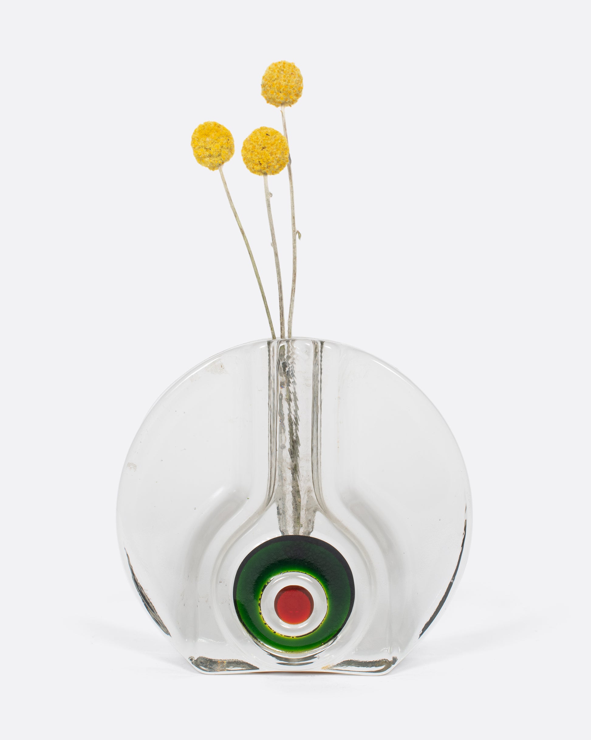 A unique vintage German glass crystal , flattened round bud vase, with a red and green bullseye that resembles a seed growing.