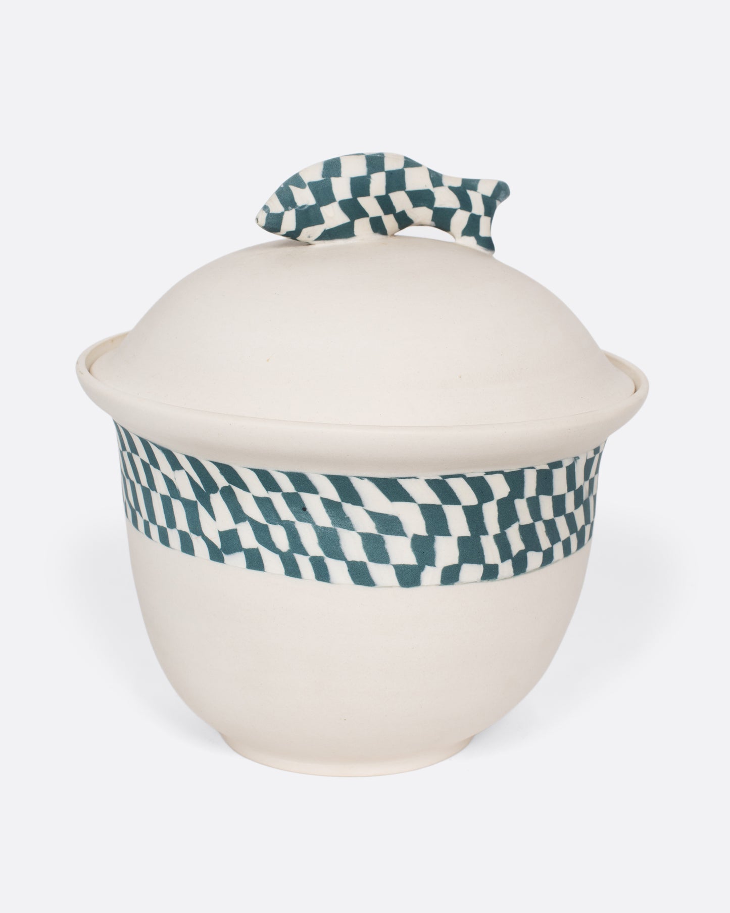  A vintage Nerikomi casserole dish with a blue and white checkered fish handle. The Japanese Nerikomi ceramic technique involves stacking and cutting colored pieces of clay, creating this beautiful checkered effect.