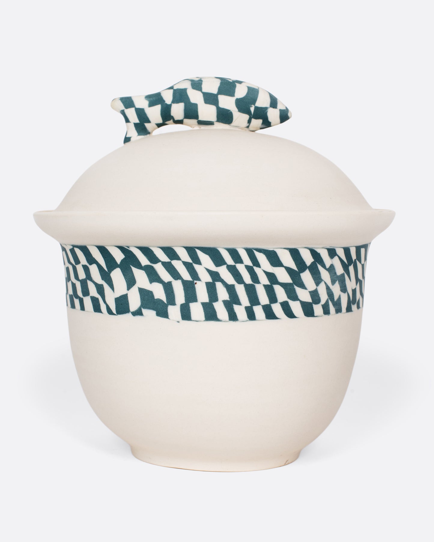 A vintage Nerikomi casserole dish with a blue and white checkered fish handle. The Japanese Nerikomi ceramic technique involves stacking and cutting colored pieces of clay, creating this beautiful checkered effect.