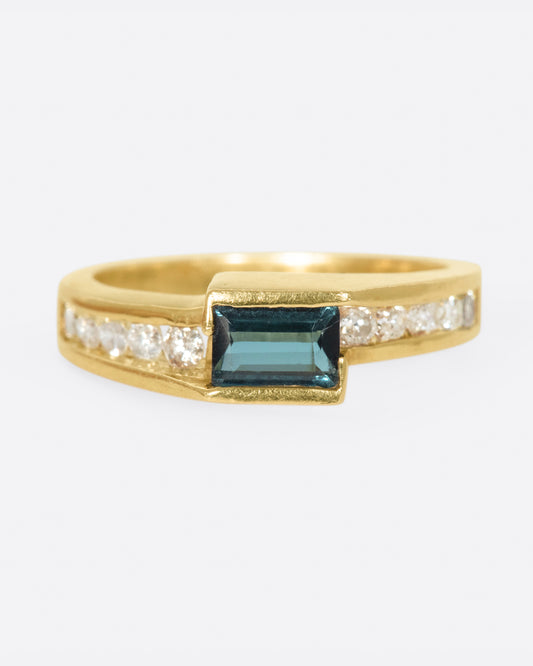 This ring is a trifecta of some of our favorite things; geometry, color and sparkle.