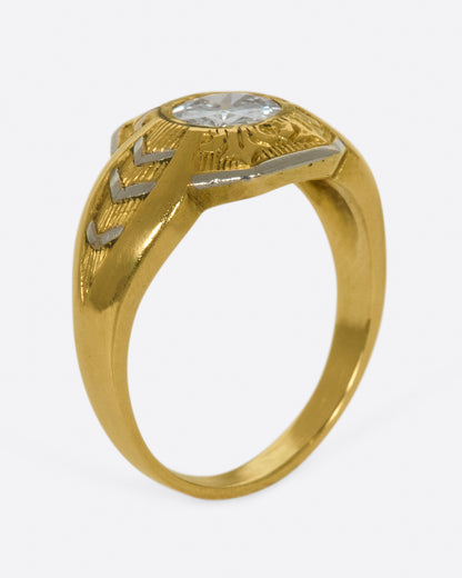 Vintage gold and platinum diamond ring, angled view showing the height of the setting and the engraved shoulders