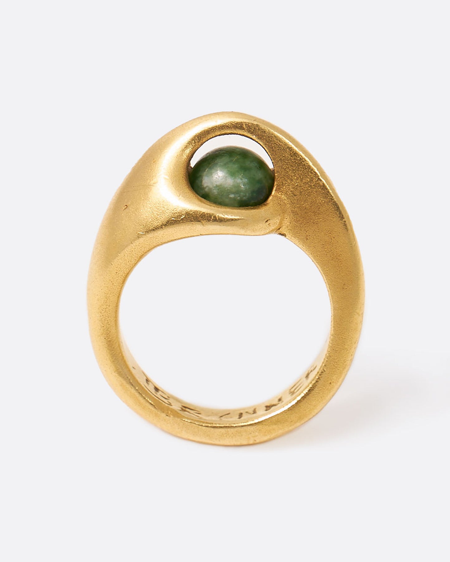 Yellow gold ring with floating green sodalite sphere, shown from the side.