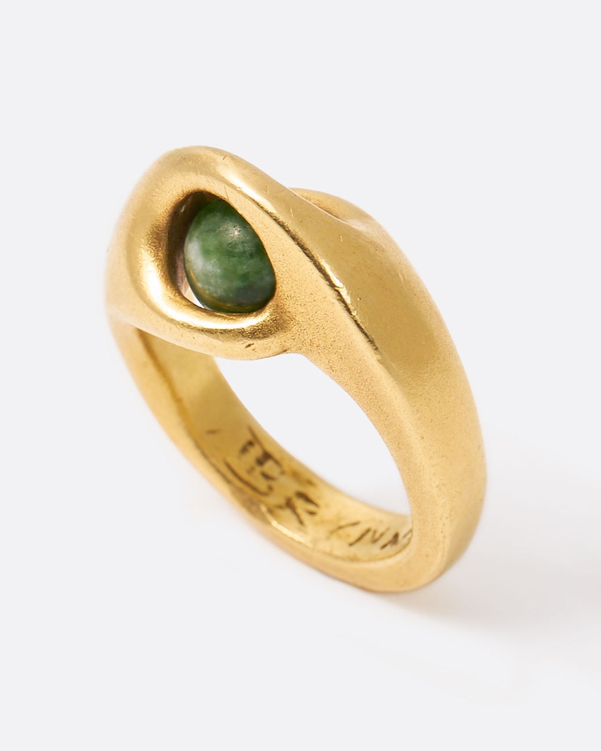 Yellow gold ring with floating green sodalite sphere, shown from the top.